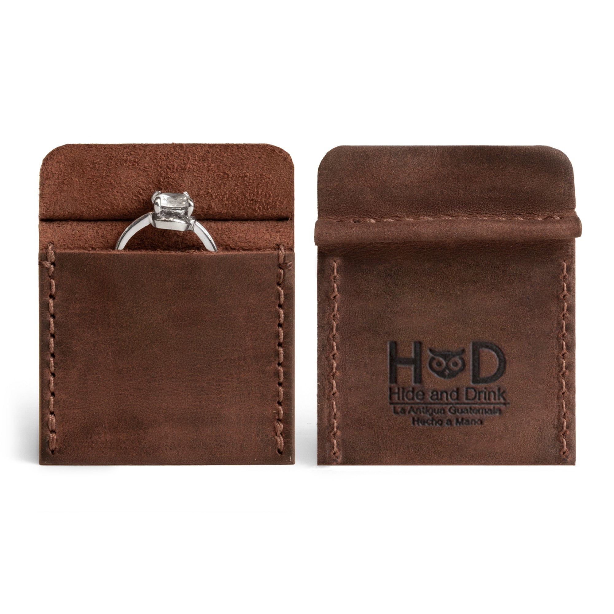 Hide & Drink Wedding Ring Case showcasing a sleek design made from full grain leather, ideal for engagement rings. Pouch Organizer for Jewelry perfect for travel or as a small bearer. Each ring box is hand cut, hand sewn, and artisan crafted in La Antigua Guatemala & Oaxaca Mexico.