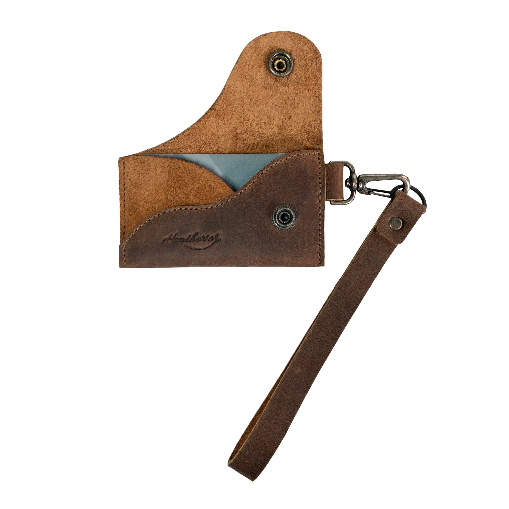 A stylish Female Wallet with Wristlet from Heather's, showcasing an ID case with wrist strap design in full grain leather. Ideal as a money holder and travel organizer, handmade in La Antigua Guatemala and Oaxaca Mexico, featuring small batch production and artisan craftsmanship.