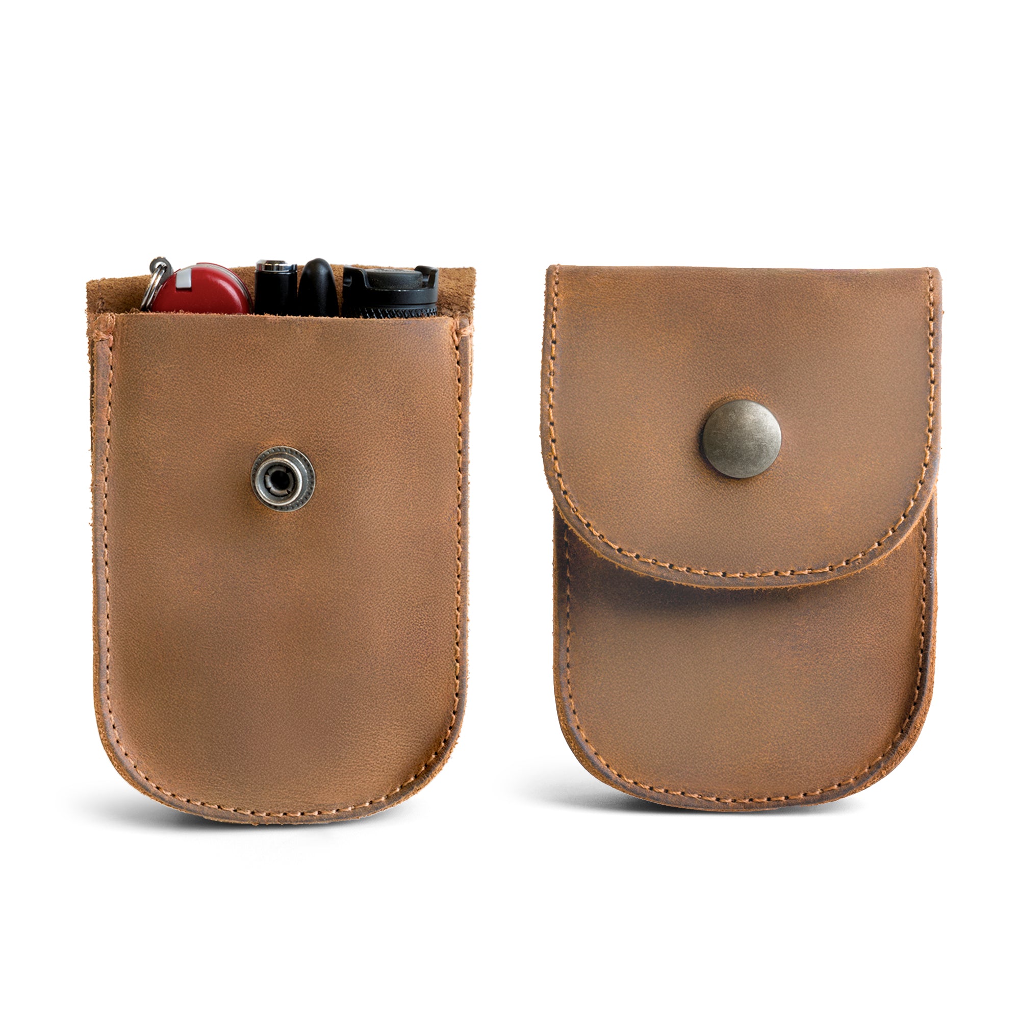 Open view of the Teal Holster Pouch by Hide & Drink with items stored inside, showcasing its functionality. Crafted from durable full grain leather, this handmade pouch is ideal for organizing everyday carry.