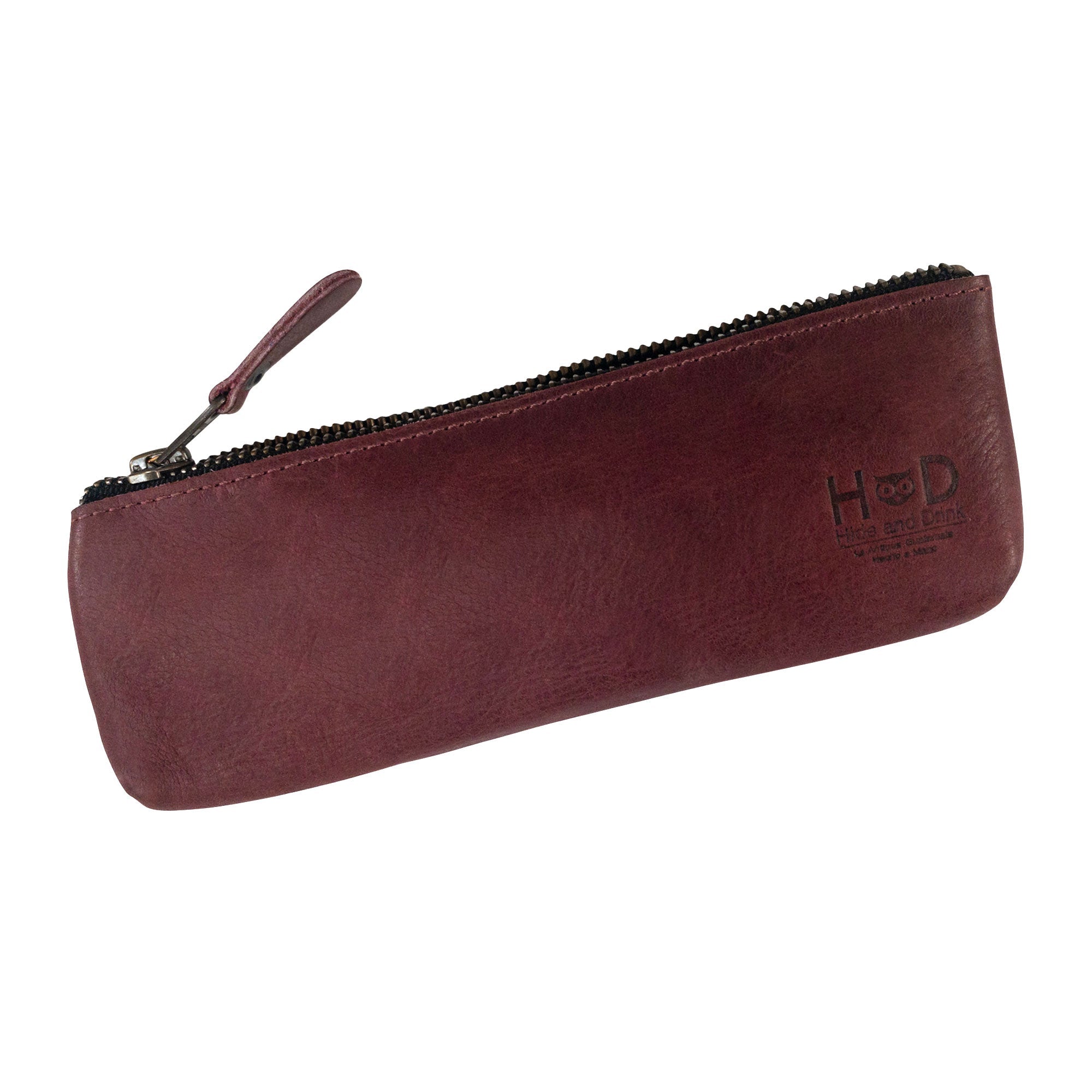 Elegant burgundy Pencil Pouch from Hide & Drink, featuring a flat zipper design suitable for both men and women. This Rectangular Pencil Case is crafted from full grain leather, showcasing classic style elements loved by artists and handmade in La Antigua Guatemala.