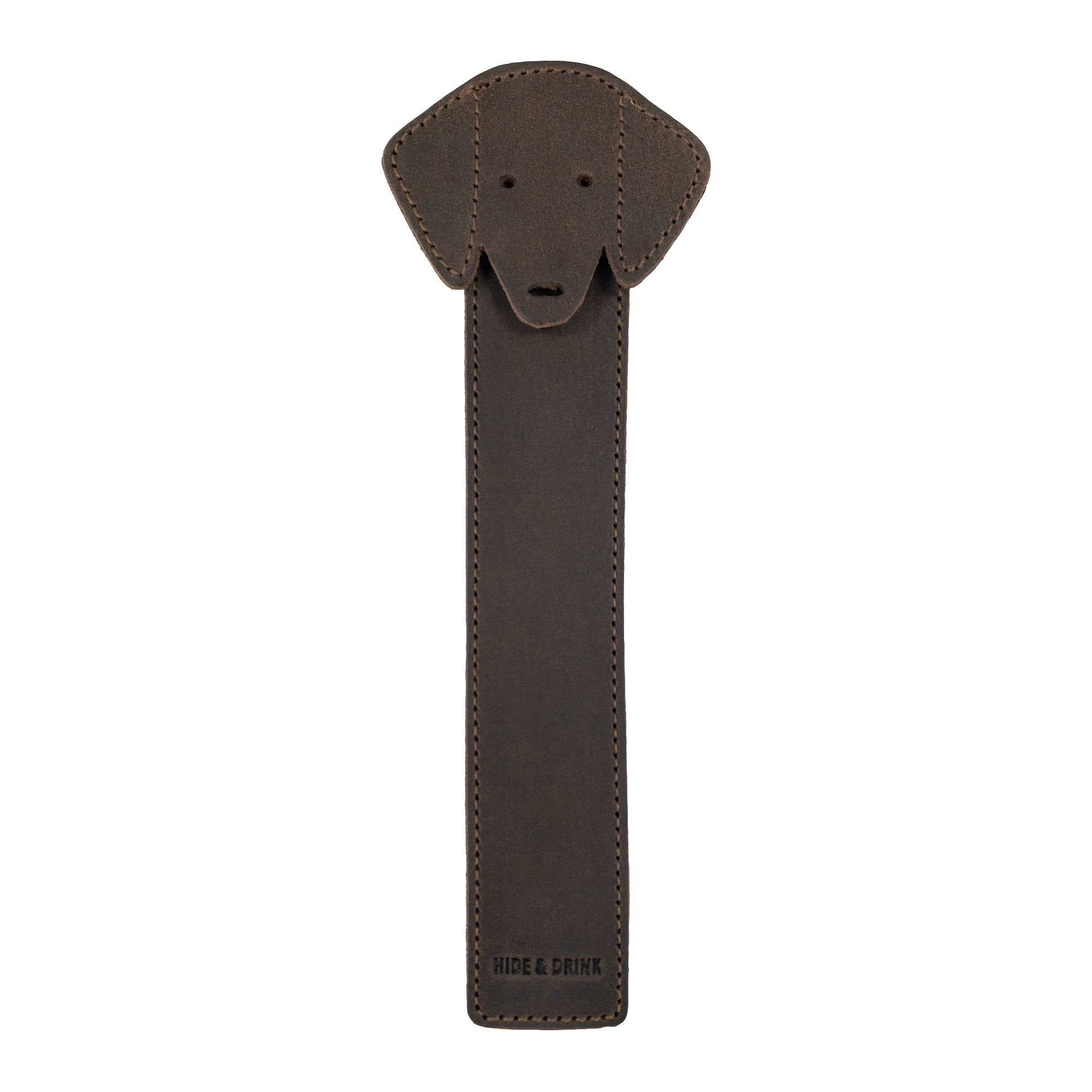 Hide & Drink's Dog Bookmark made from Full Grain Leather, showcasing a dog's face design. This handcrafted and artisan bookmark is part of a small batch production and features fire branded details, made in La Antigua Guatemala & Oaxaca Mexico.