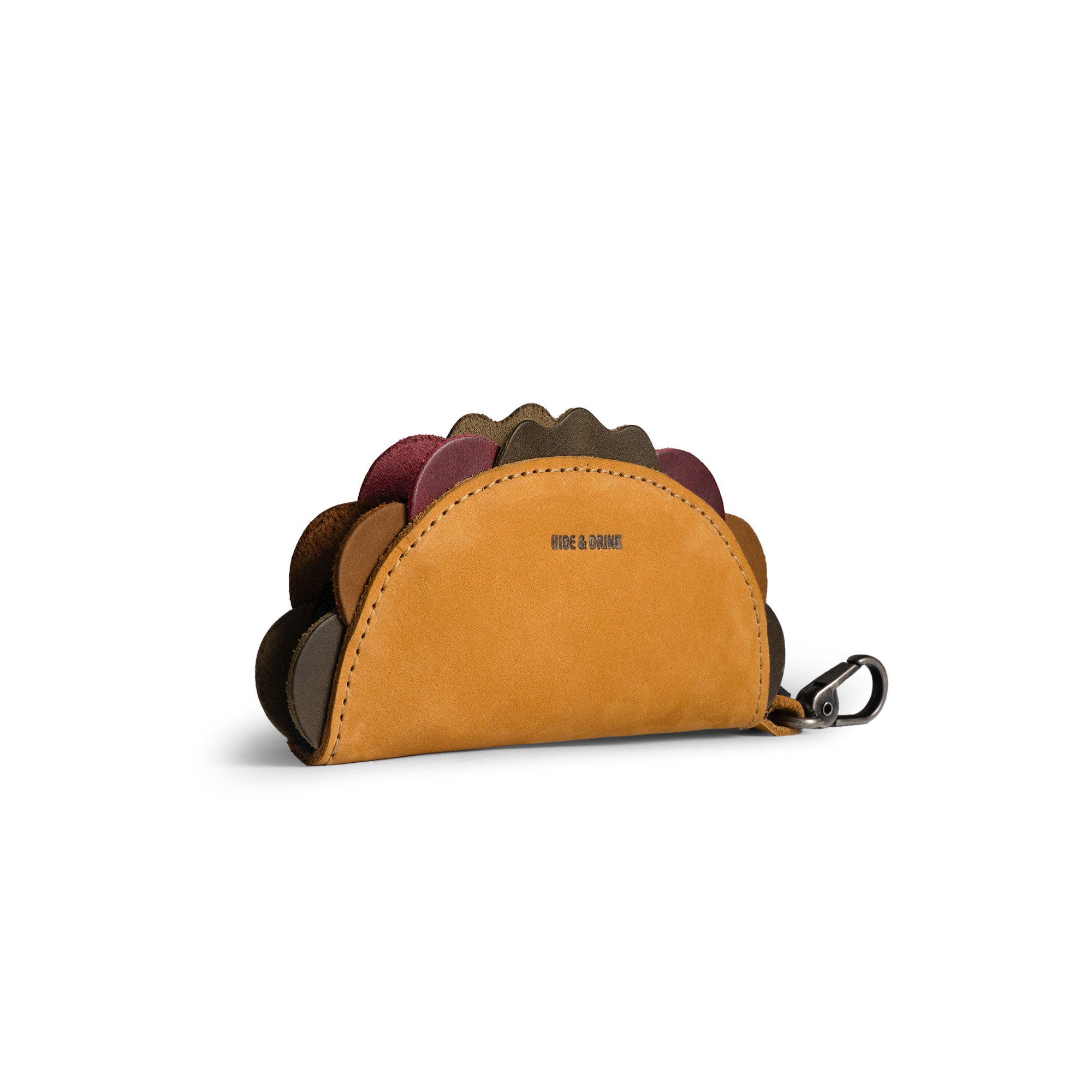 Hide & Drink Taco Zip Pouch Bag Charm Key Chain in tan full grain leather, shown as a compact taco-shaped pouch with colorful scalloped edges and a metal clip. Taco Zip Pouch Bag Charm Key Chain Full Grain Leather, StockyardX, Small Batch Production, Hand Cut, Hand Sewn, Fire Branded, Artisan, Handmade in La Antigua Guatemala & Oaxaca Mexico.