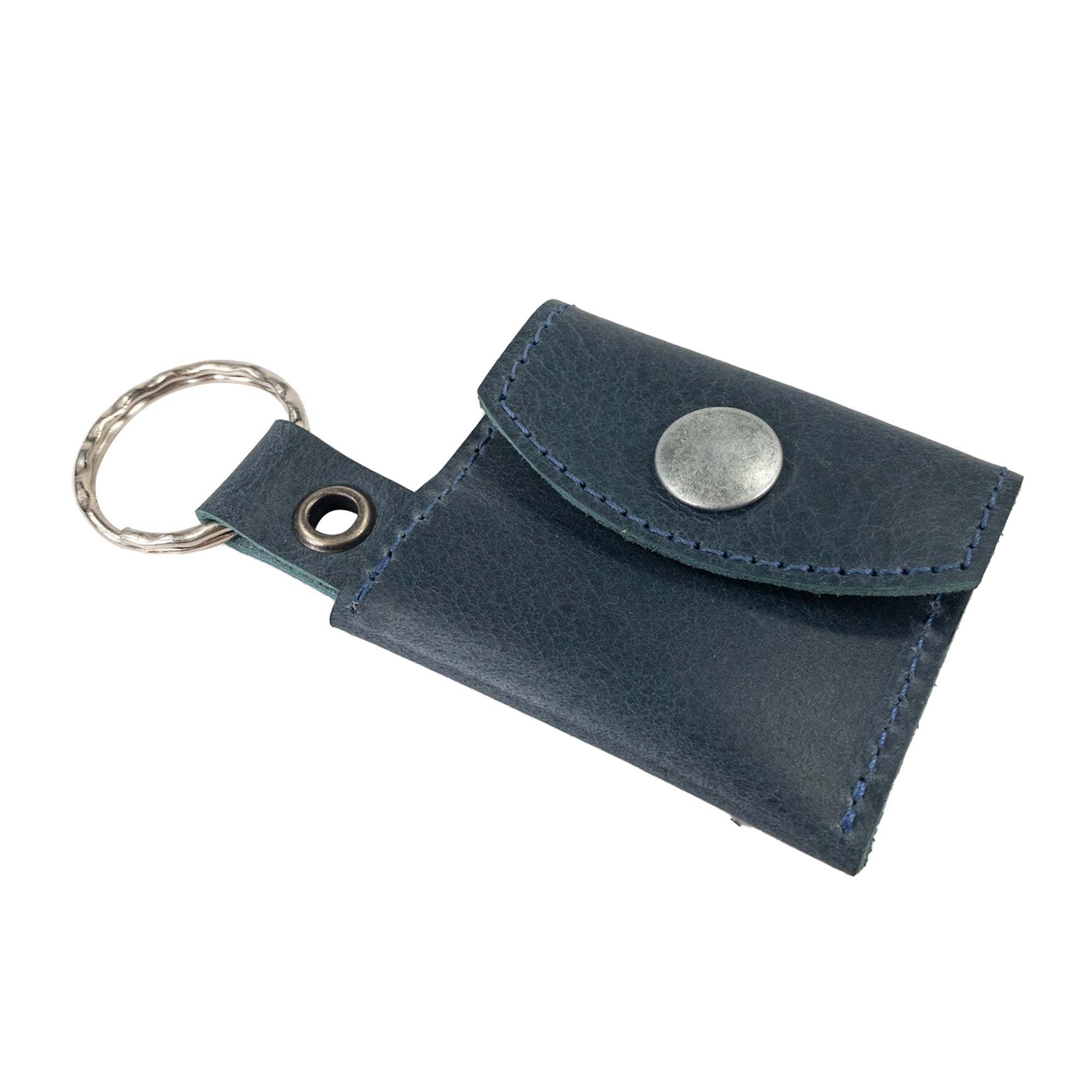 Handmade Tiny Coin Holder Keychain by Hide & Drink alongside artisan accessories, showcasing its quality in Full Grain Leather. This Tiny Coin Holder reflects small batch production excellence.