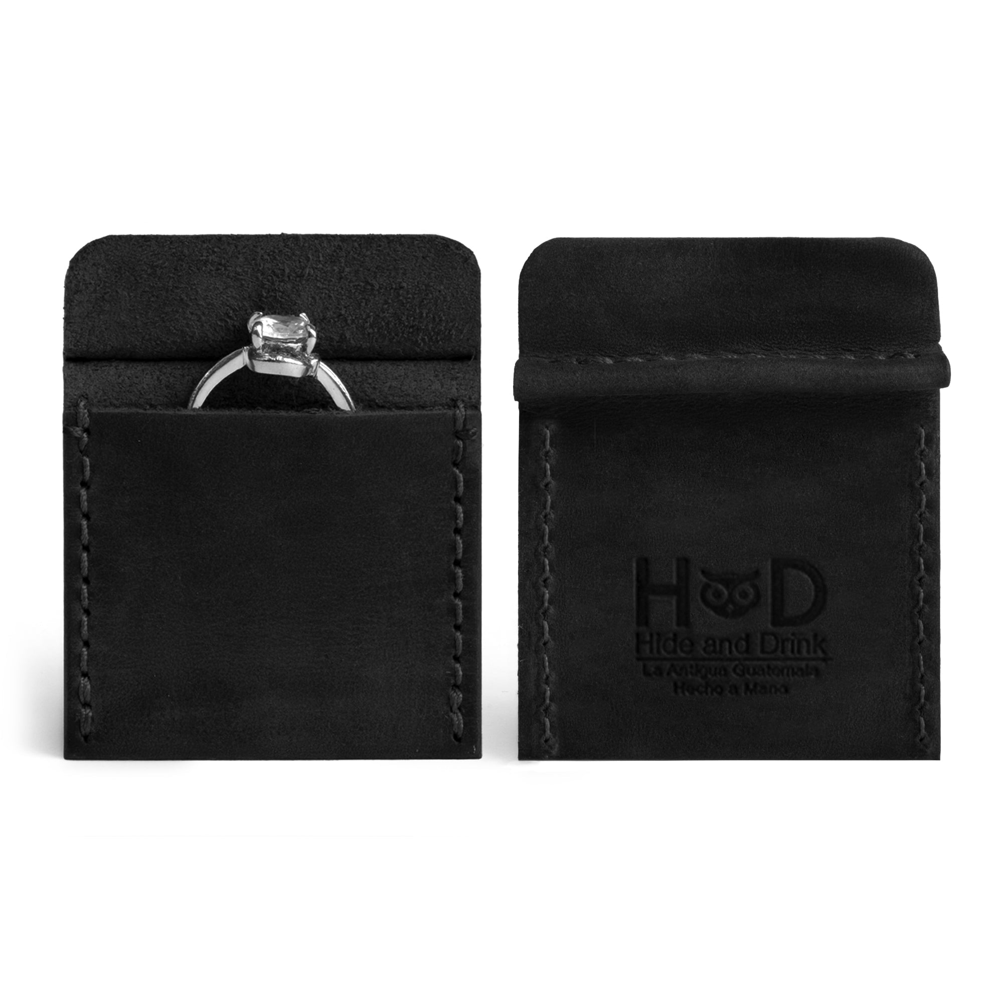 Hide & Drink Wedding Ring Case presenting an engagement ring, highlighting craftsmanship in full grain leather. This pouch organizer for travel and jewelry is designed to be a small batch production item, handmade in La Antigua Guatemala & Oaxaca Mexico.