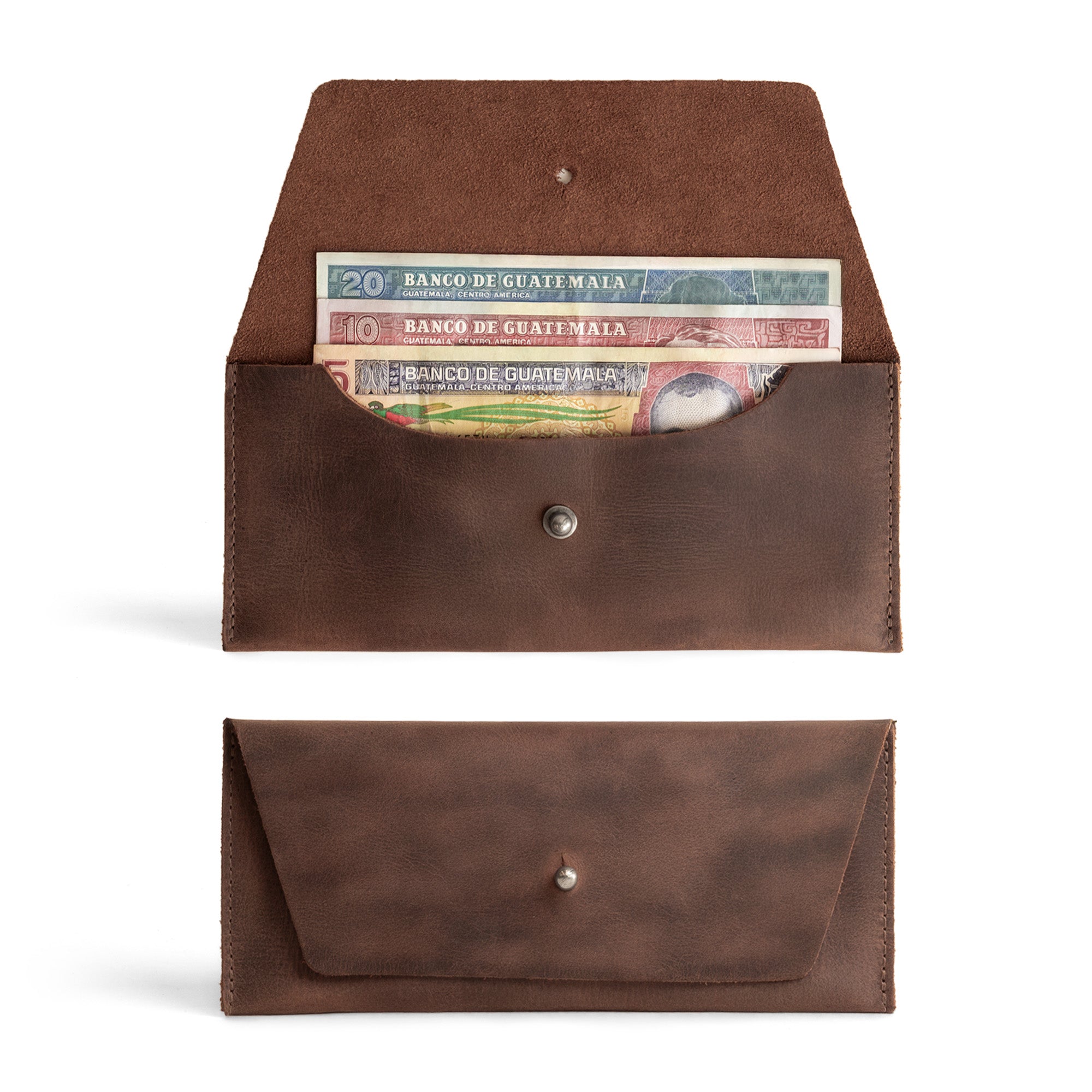 Image of the Long Utility Pouch by Hide & Drink, showcasing the handmade full grain leather wallet with cash stored inside. This stylish wallet is perfect for carrying and storing cash, coins, and cards, crafted with care in La Antigua Guatemala & Oaxaca Mexico.