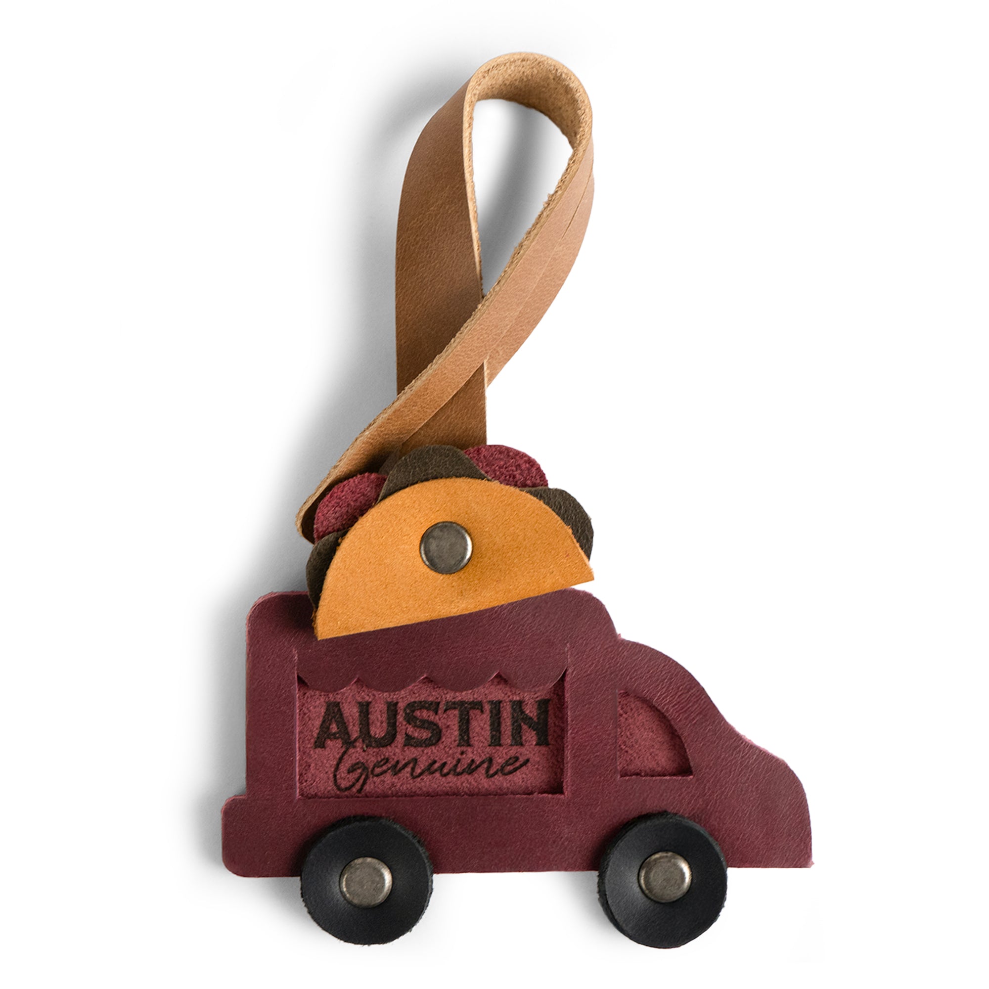 Bag Charms by Austin Genuine includes a taco truck leather charm. This Austin Genuine Bag Charm showcases 7 unique designs made with full grain leather from StockyardX, crafted through small batch production, hand cut, hand sewn, and fire branded, artisan, handmade in La Antigua Guatemala & Oaxaca Mexico.