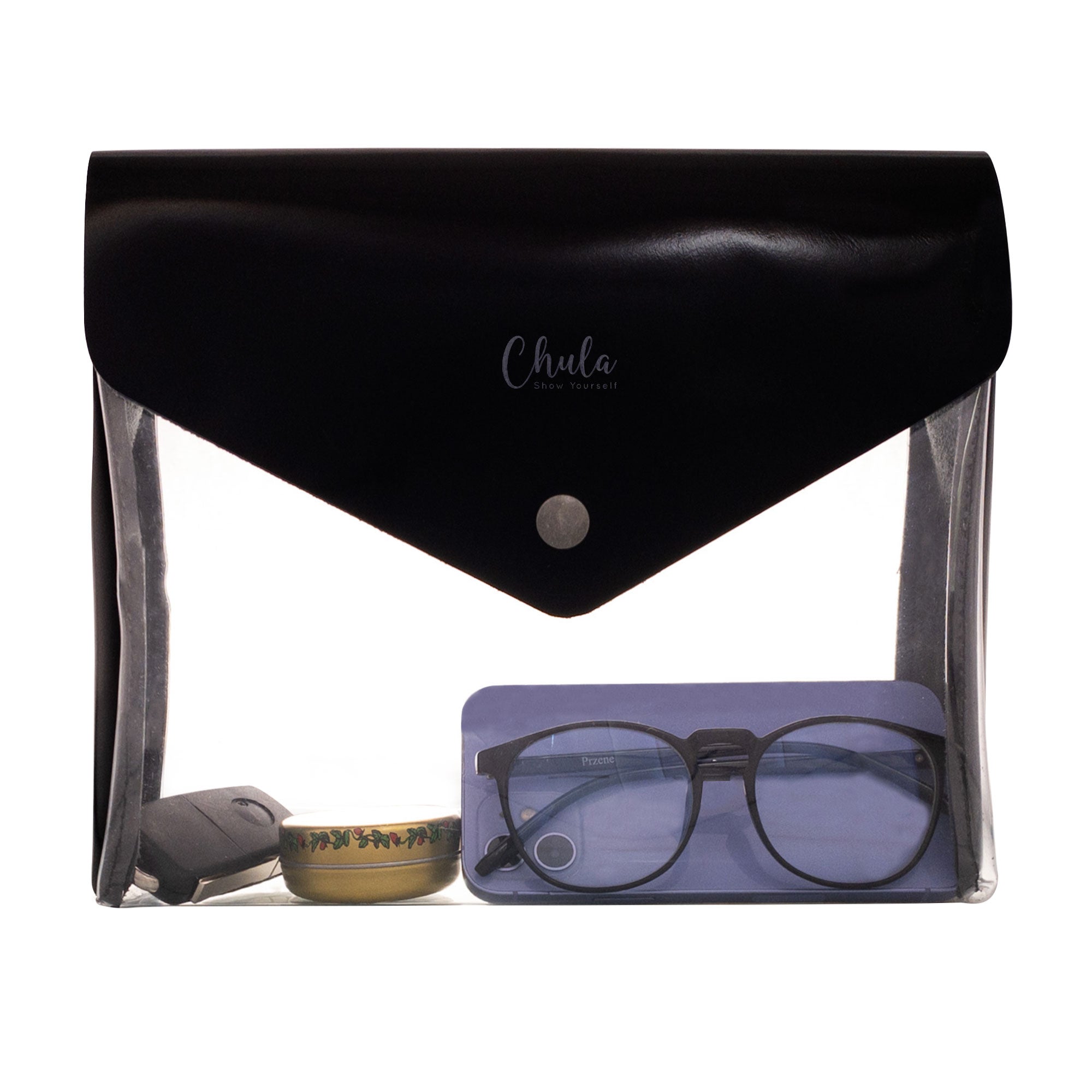 Chula Rectangular Purse showcasing a transparent PVC front with essential items inside. Ideal for travel, this stylish Rectangular Bag for Travel is perfect for carrying makeup, wallets, and toiletries. It combines durable PVC Material and Full Grain Leather, emphasizing small batch production and artisan craftsmanship, handmade in La Antigua Guatemala.