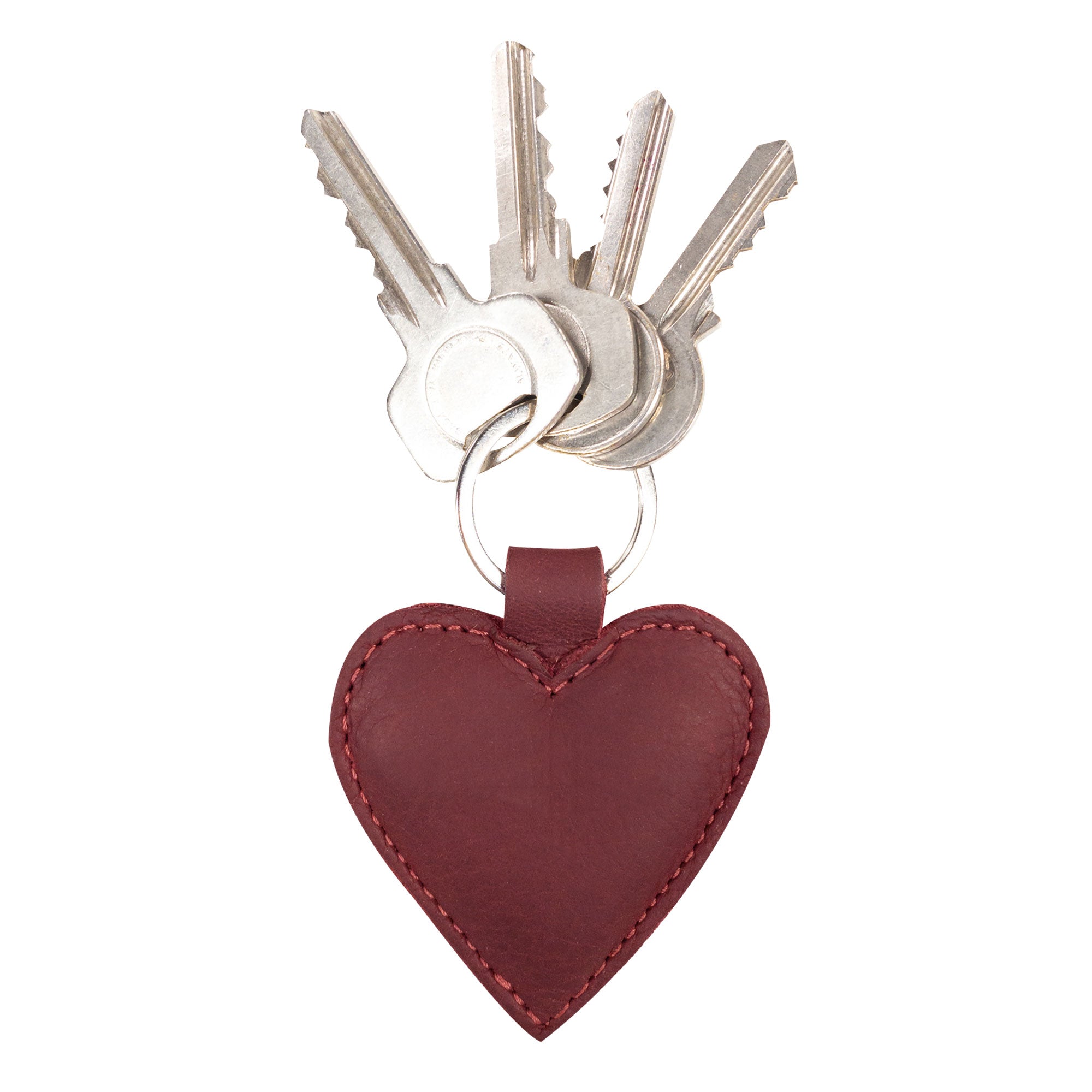 A vibrant Heart Keychain by Hide & Drink, featuring a heart-shape design that adds a charming touch to your key organizer. Made from durable Full Grain Leather, this cute accessory is hand cut and hand sewn by artisans in La Antigua Guatemala & Oaxaca Mexico. Perfect for keeping your keys stylishly together, this keyring holder stands out as a piece of small batch production.