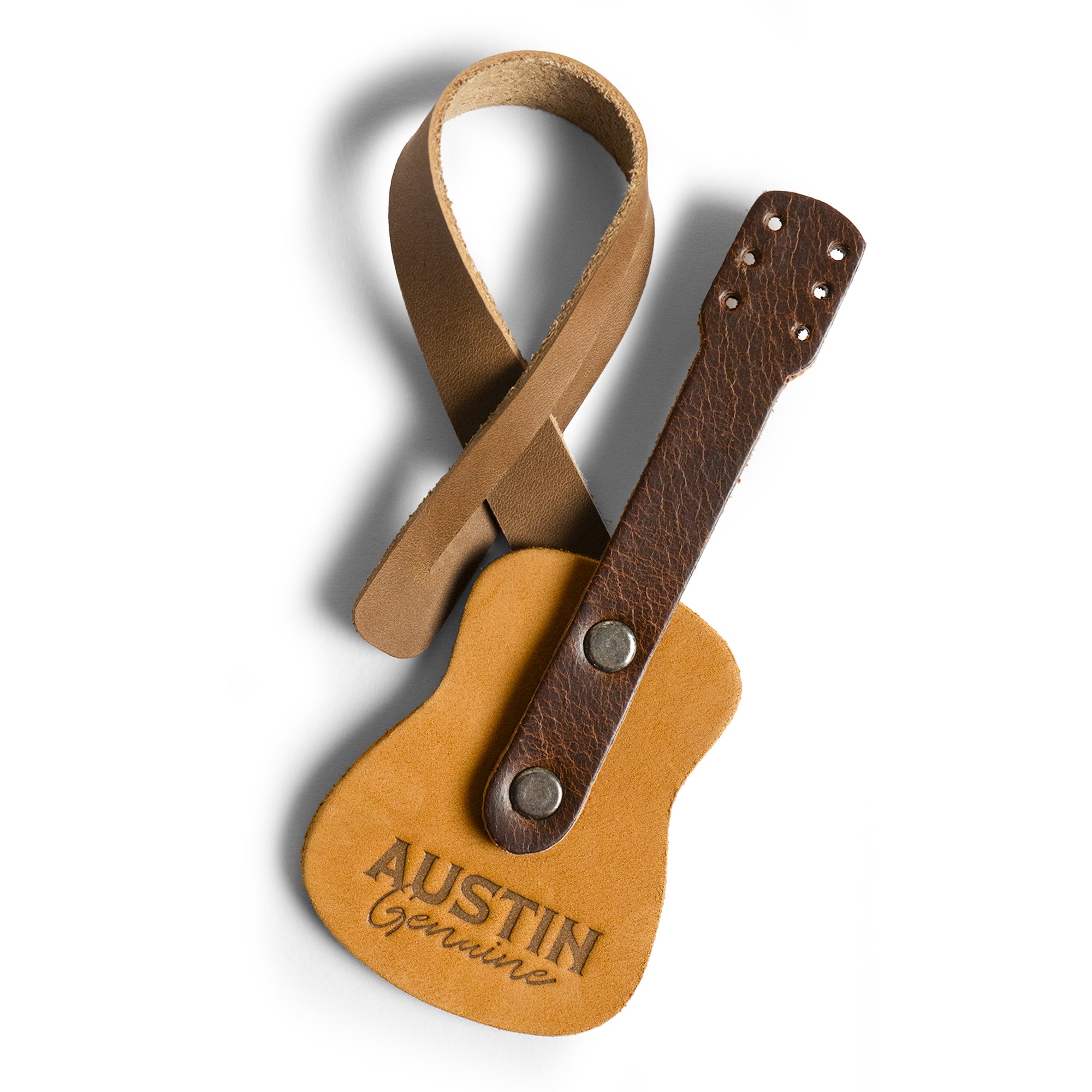 Bag Charms by Austin Genuine features a leather guitar charm. This Austin Genuine Bag Charm showcases 7 unique designs made with full grain leather from StockyardX, crafted through small batch production, hand cut, hand sewn, and fire branded, artisan, handmade in La Antigua Guatemala & Oaxaca Mexico.