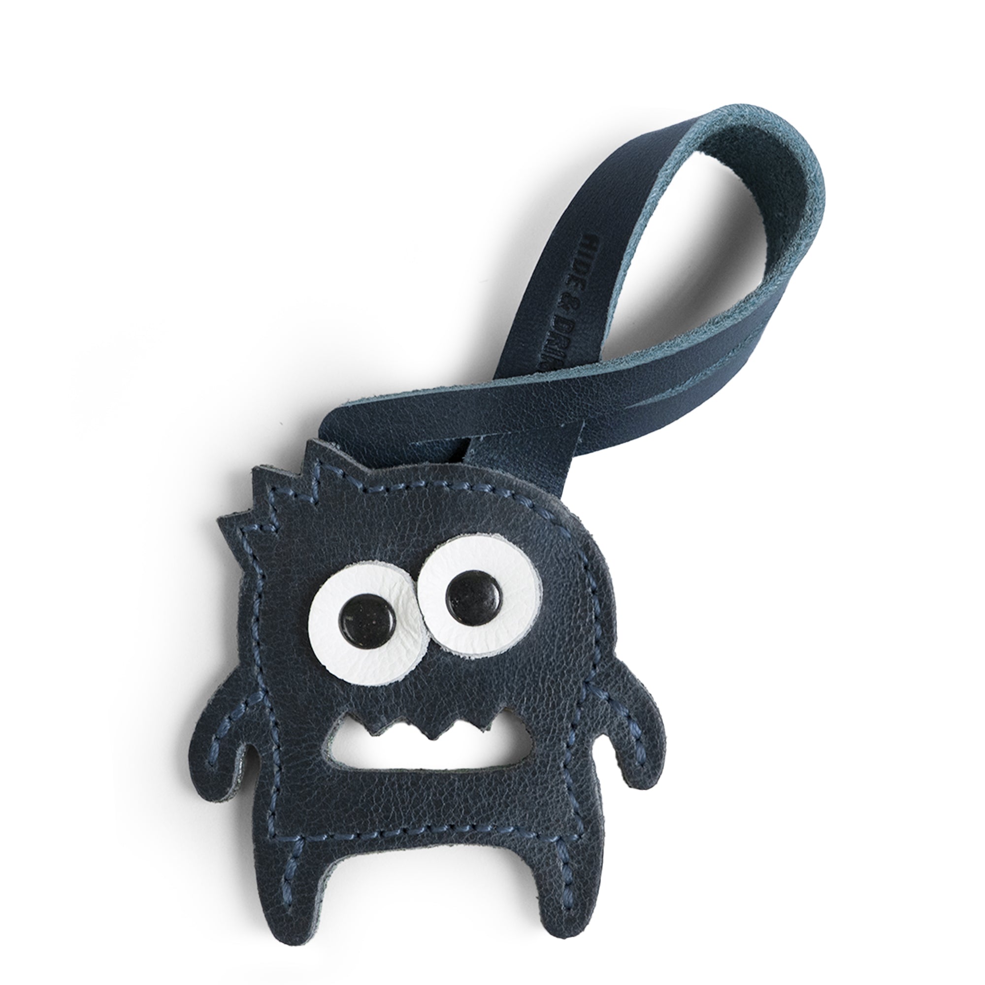 Hide & Drink Bag Charms showcasing a unique skull design combined with floral accents, making it the ideal charm for handbags. This purse charm for tote & backpacks is made from high-quality full grain leather, reflecting StockyardX's commitment to small batch production. Each piece displays meticulous hand cut, hand sewn craftsmanship combined with fire branding, handmade in La Antigua Guatemala & Oaxaca Mexico.