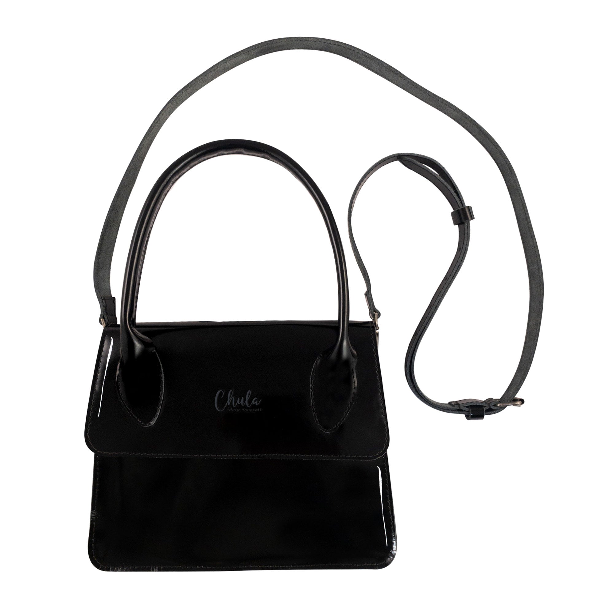 Chula Rectangular Bag with Hanger featuring a sleek black design and a detachable shoulder strap, perfect as an evening bag or handbag for women. Crafted from full grain leather, this stylish purse represents small batch production and is handmade in La Antigua Guatemala.