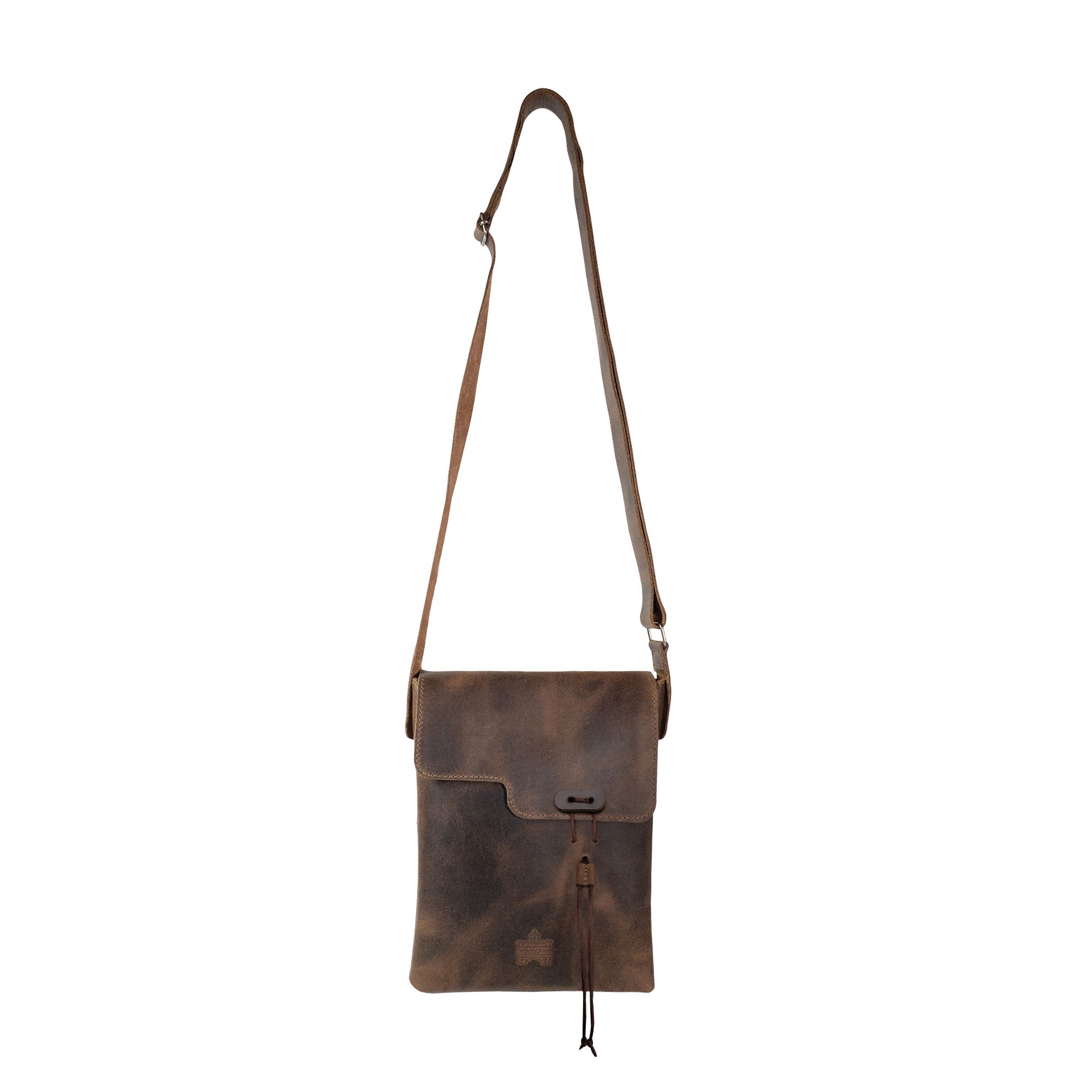 La Antigua Treasure Crossbody Bag showcasing the rustic design, made from full grain leather with an adjustable shoulder strap. This vintage satchel serves as a perfect travel accessory. Hand cut and hand sewn in small batch production in La Antigua Guatemala.