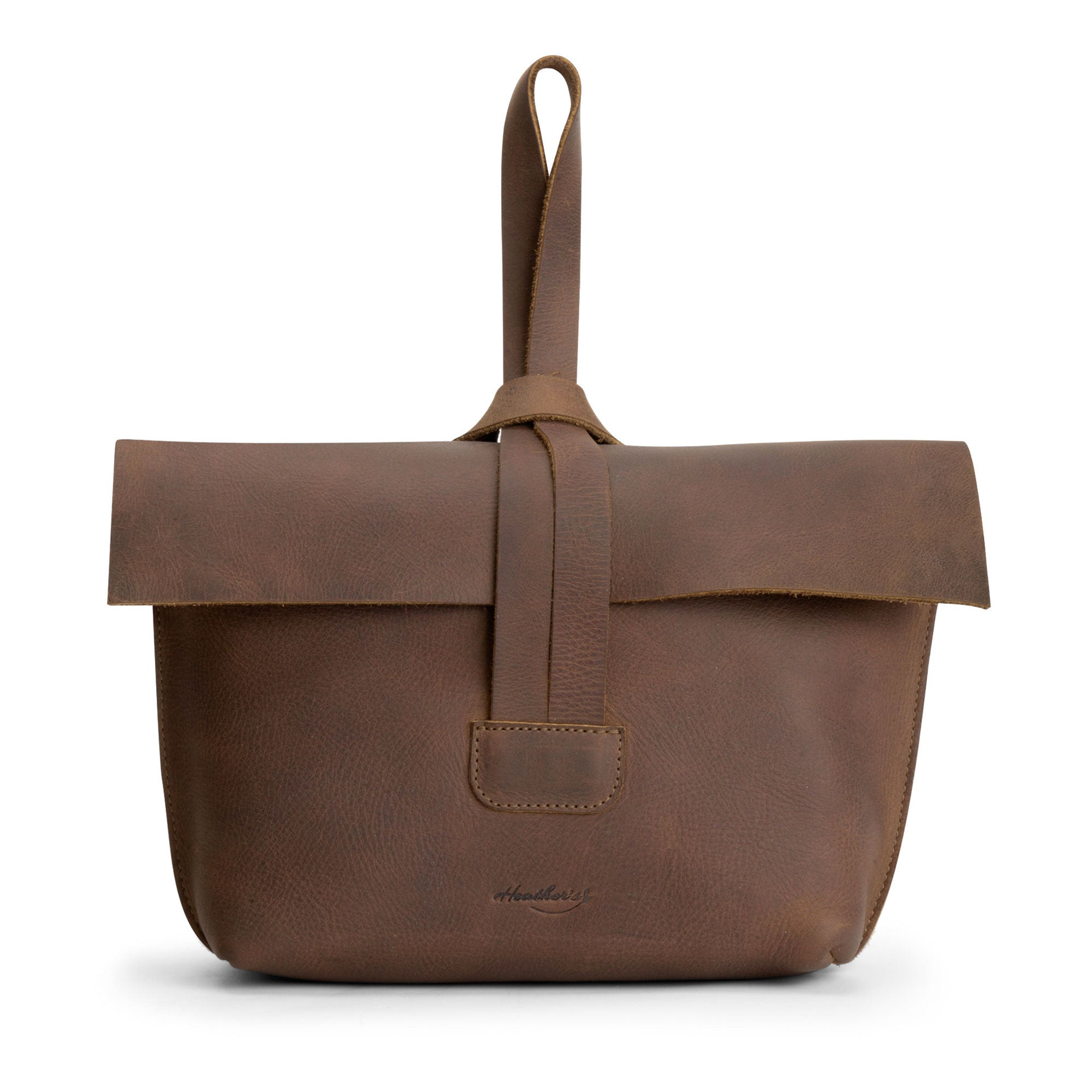 Stylish Women's Clutch Bag by Heather's, made from Full Grain Leather, showcasing its practical design as a travel case for cosmetics and toiletries. Perfect for everyday use and small batch production, handmade in La Antigua Guatemala.