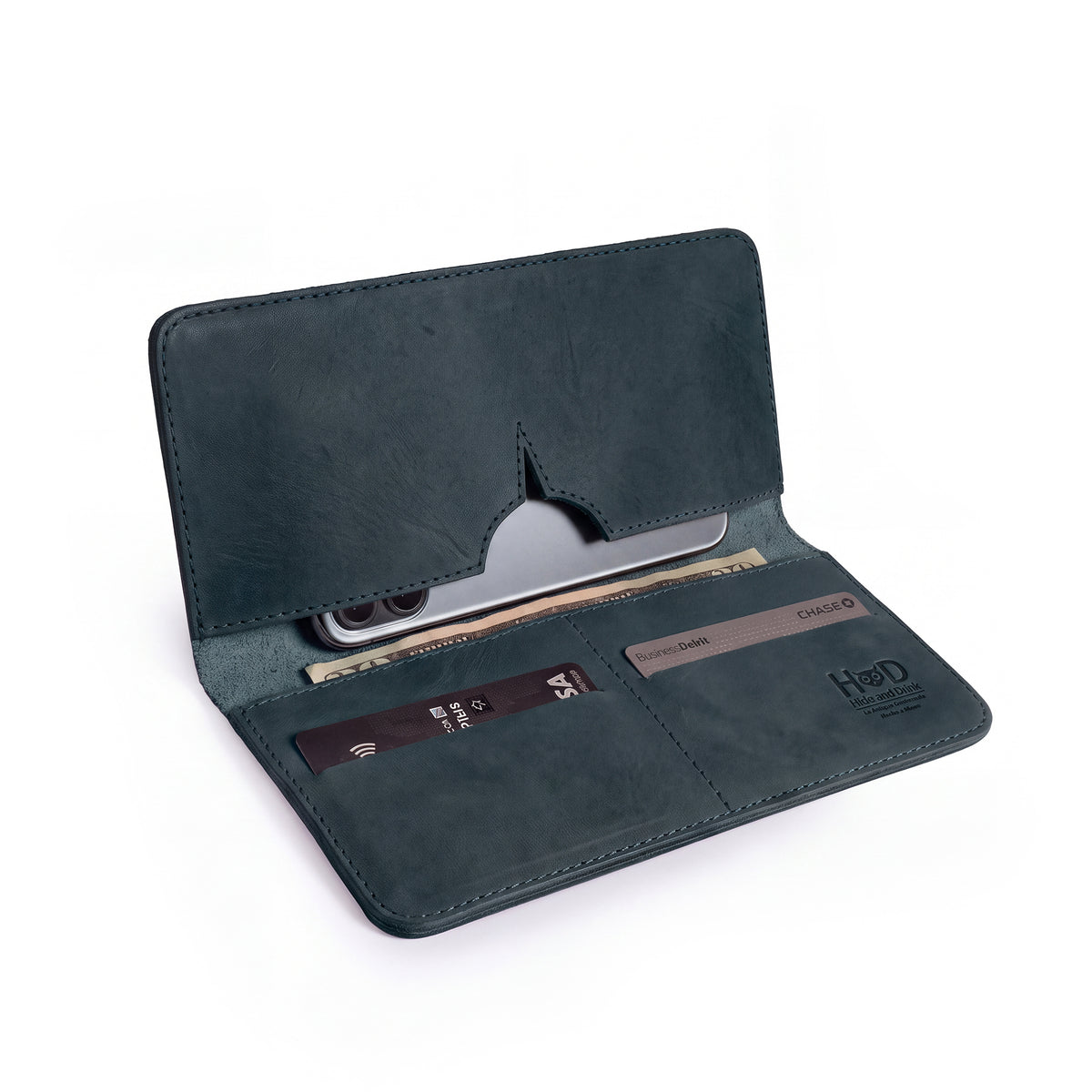 Open bifold wallet for cellphone by Hide & Drink, featuring compartments for cards and cash. This stylish Bifold Wallet for Cellphone is crafted from premium Full Grain Leather, blending practicality with elegance. Discover the artisan quality from small batch production in La Antigua Guatemala & Oaxaca Mexico.