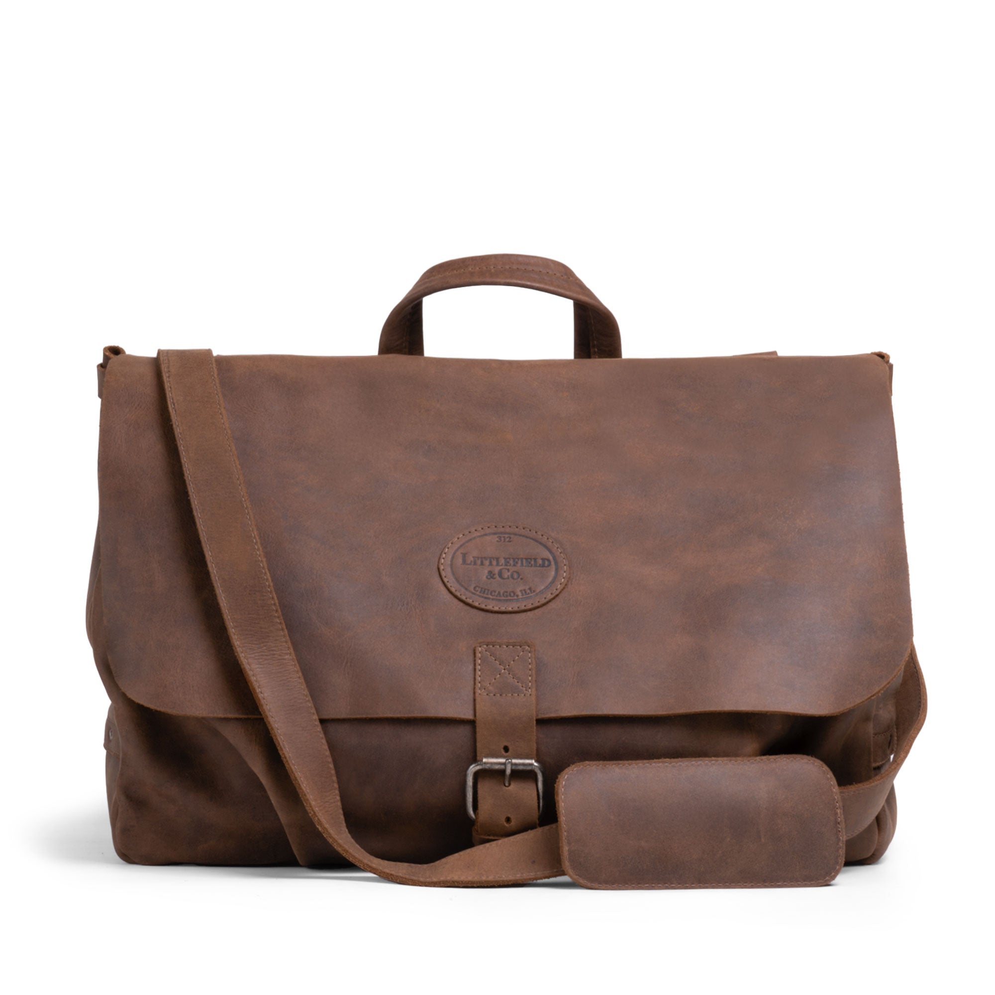 Vintage Mail Carrier Weekend Duffle by Littlefield & Co., showcasing a stylish Mail Carrier Satchel with Adjustable Shoulder Strap, made from Full Grain Leather. This Messenger Bag functions as a Large Briefcase or Crossbody Bag for Men, featuring StockyardX's Small Batch Production, hand-cut, and hand-sewn craftsmanship, fire branded by artisans handmade in La Antigua Guatemala & Oaxaca Mexico.