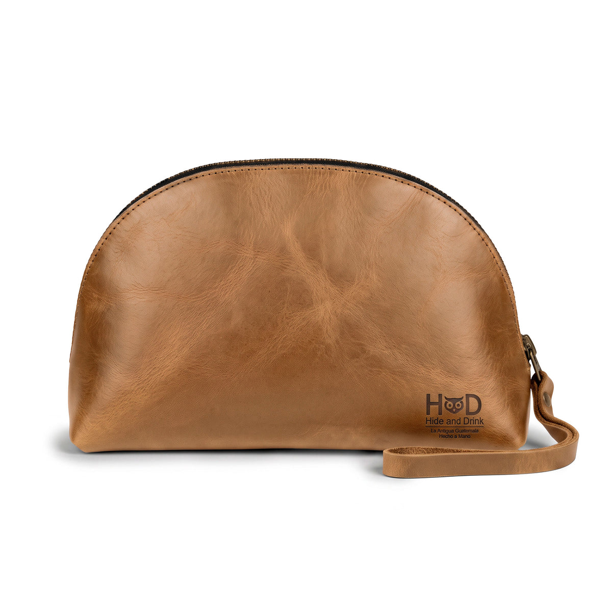Front view of the Accessory Pouch Organizer Hand Bag by Hide & Drink, crafted from brown full grain leather. Ideal as a Cosmetic Travel Organizer with Hand Strap for Women, it serves as a stylish Makeup Bag and Classic Handbag, showcasing craftsmanship from La Antigua Guatemala & Oaxaca Mexico.