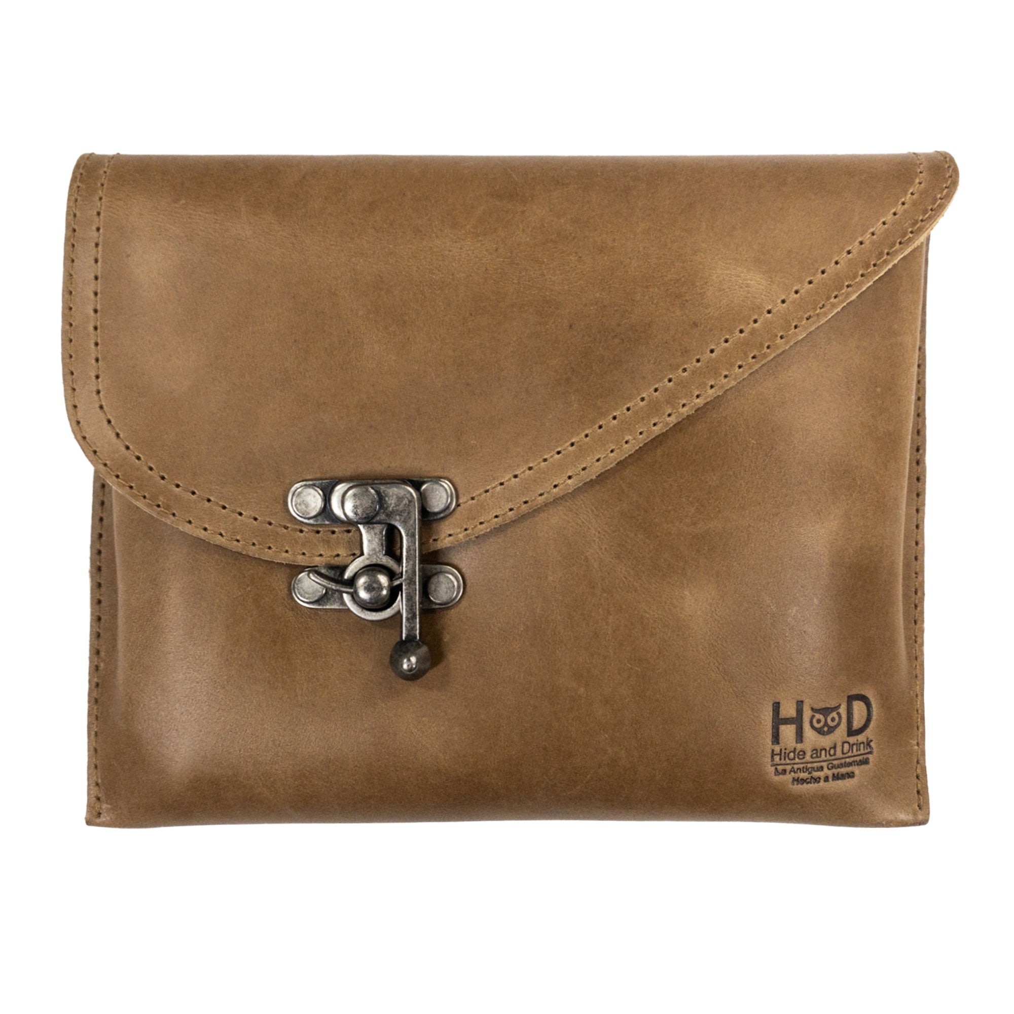 Front view of the tan version of the Petite Vintage Clutch Bag by Hide & Drink, emphasizing its vintage design and clasp. This stylish handbag is made from full grain leather, serving well as an evening bag or travel accessory, handcrafted in La Antigua Guatemala & Oaxaca Mexico.