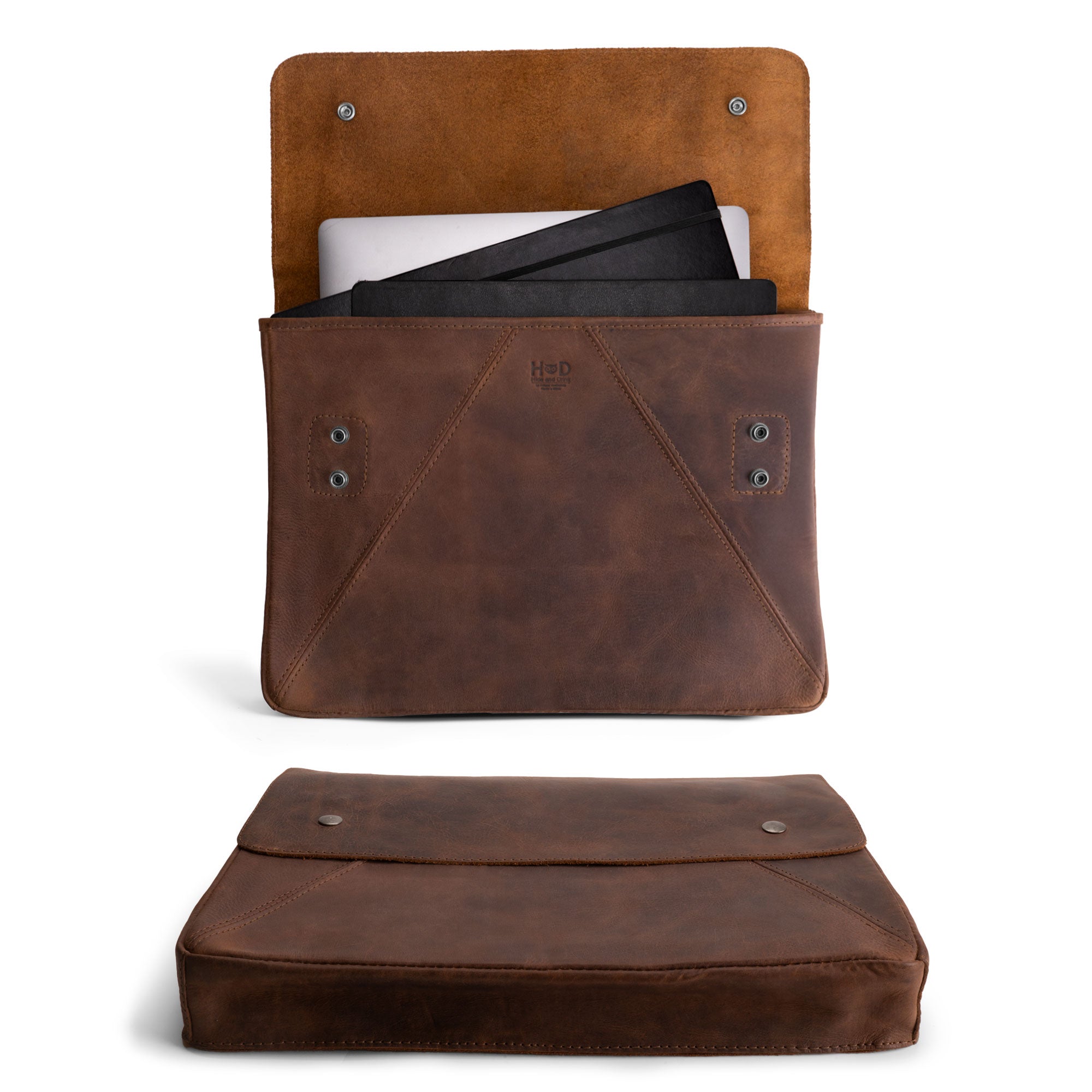 Hide & Drink's Vintage Folder Holder XL made of Full Grain Leather, showcasing its rustic design and functionality for organizing documents. Perfect as an office accessory, this artisan-made leather folder features hand cut and sewn details. Ideal for holding contracts and legal papers, it reflects the craftsmanship from La Antigua Guatemala and Oaxaca Mexico.