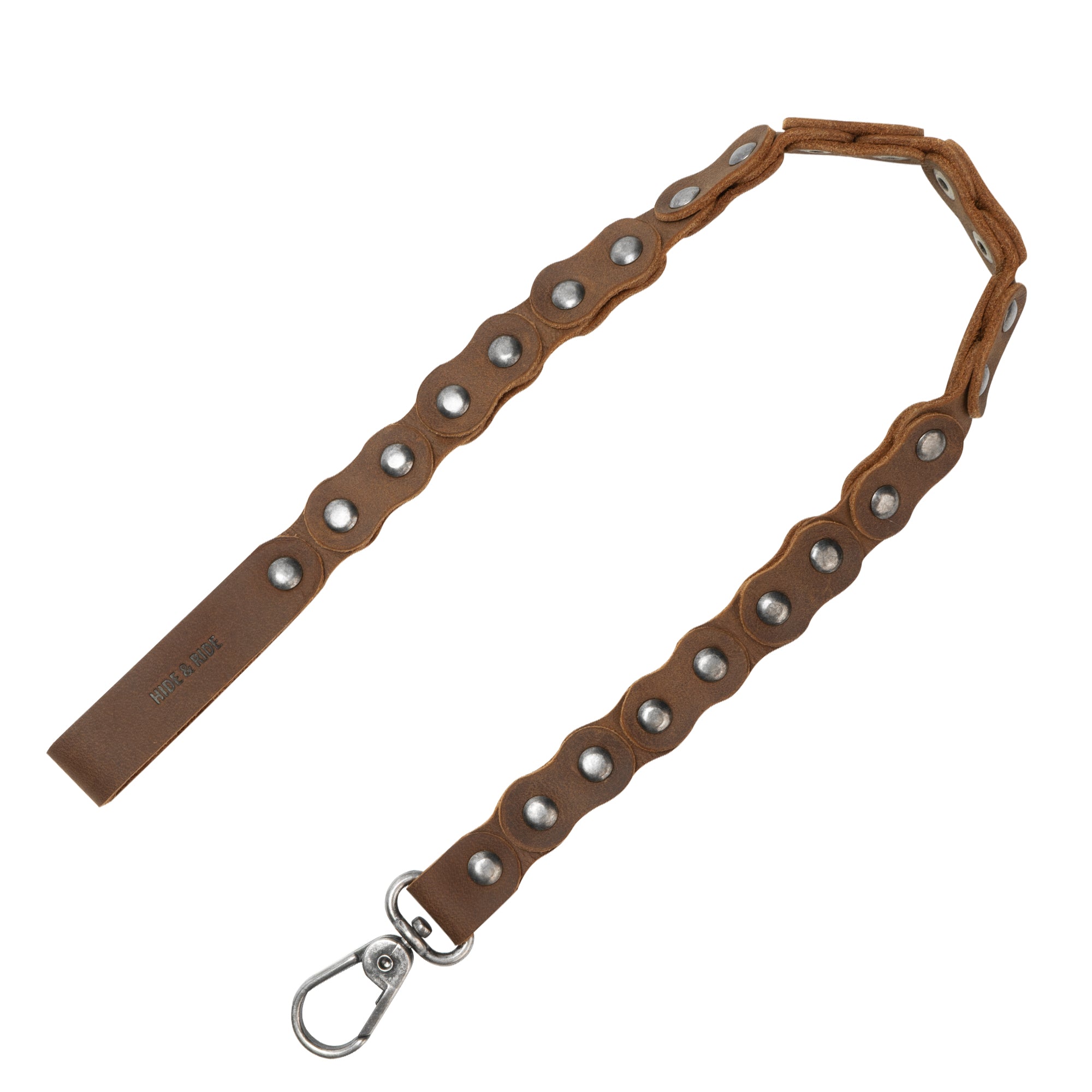 Showcasing the Biker Chain by Hide & Ride, this tough trouser chain is designed for bikers. Crafted from full grain leather, it makes an excellent wallet chain or jeans pocket chain, perfect as a belt accessory. This handmade product reflects StockyardX's commitment to small batch production, featuring hand cut and hand sewn details for durability, all while being fire branded by artisans in La Antigua Guatemala & Oaxaca Mexico.