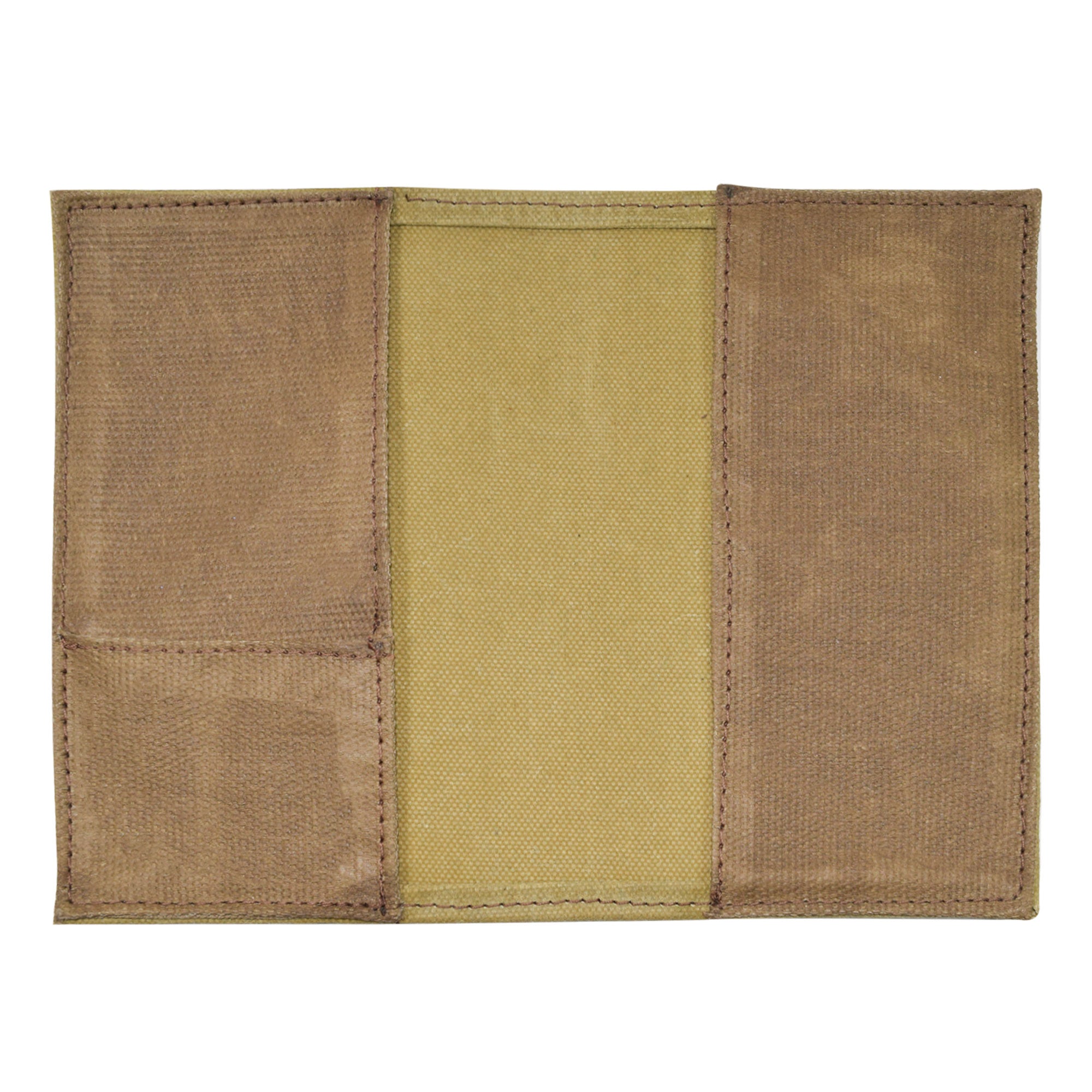 Back view of the Hide & Drink Waxed Canvas Field Notes Cover, showcasing its simple yet functional design. This durable journal cover, made from Full Grain Leather, includes compartments for cards and writing tools, emphasizing the handmade craftsmanship from La Antigua Guatemala & Oaxaca Mexico.