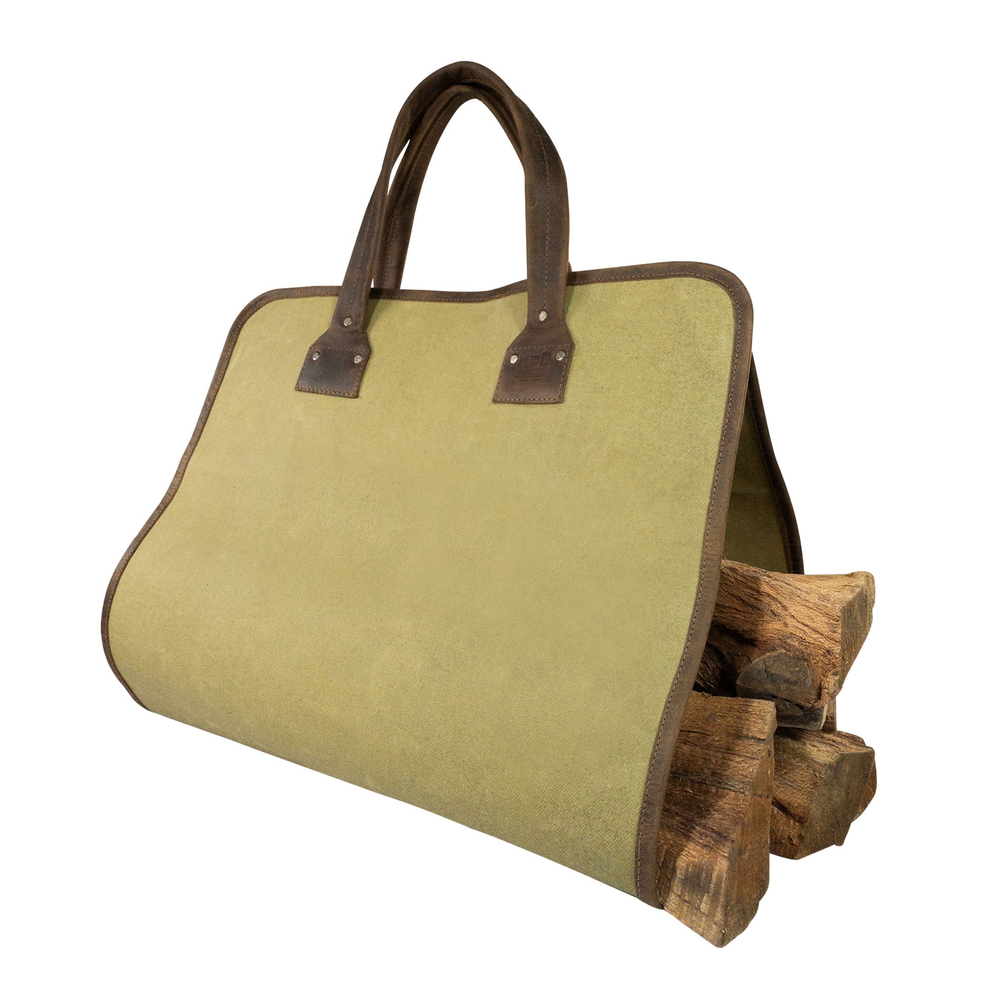 Hide & Drink Firewood Bag displayed with logs, showcasing the unique waxed canvas and full grain leather handles that age beautifully over time. Firewood Bag With Leather Liner, Full Grain Leather, StockyardX, Small Batch Production, Hand Cut, Hand Sewn, Fire Branded, Artisan, Handmade in La Antigua Guatemala & Oaxaca Mexico.