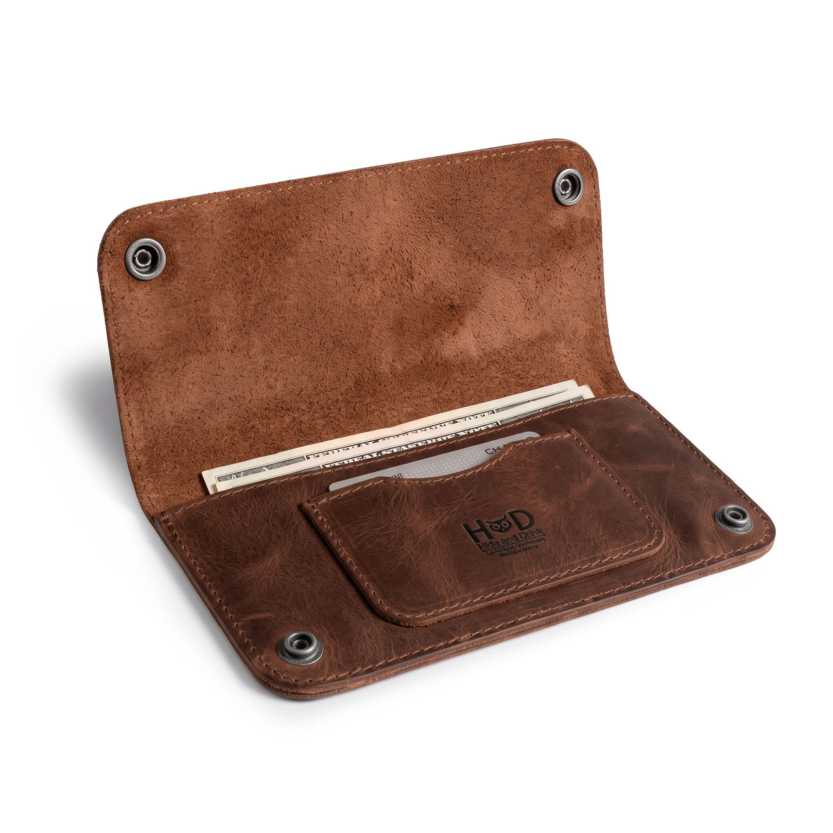 Open view of the Brown Double Snap Folio Wallet by Hide & Drink, revealing its practical design for holding cash and cards. This full grain leather wallet acts as a rectangular flat bill holder with card slot, an ideal night bag and travel accessory. Hand crafted in La Antigua Guatemala & Oaxaca Mexico, showcasing the dedication of small batch production.