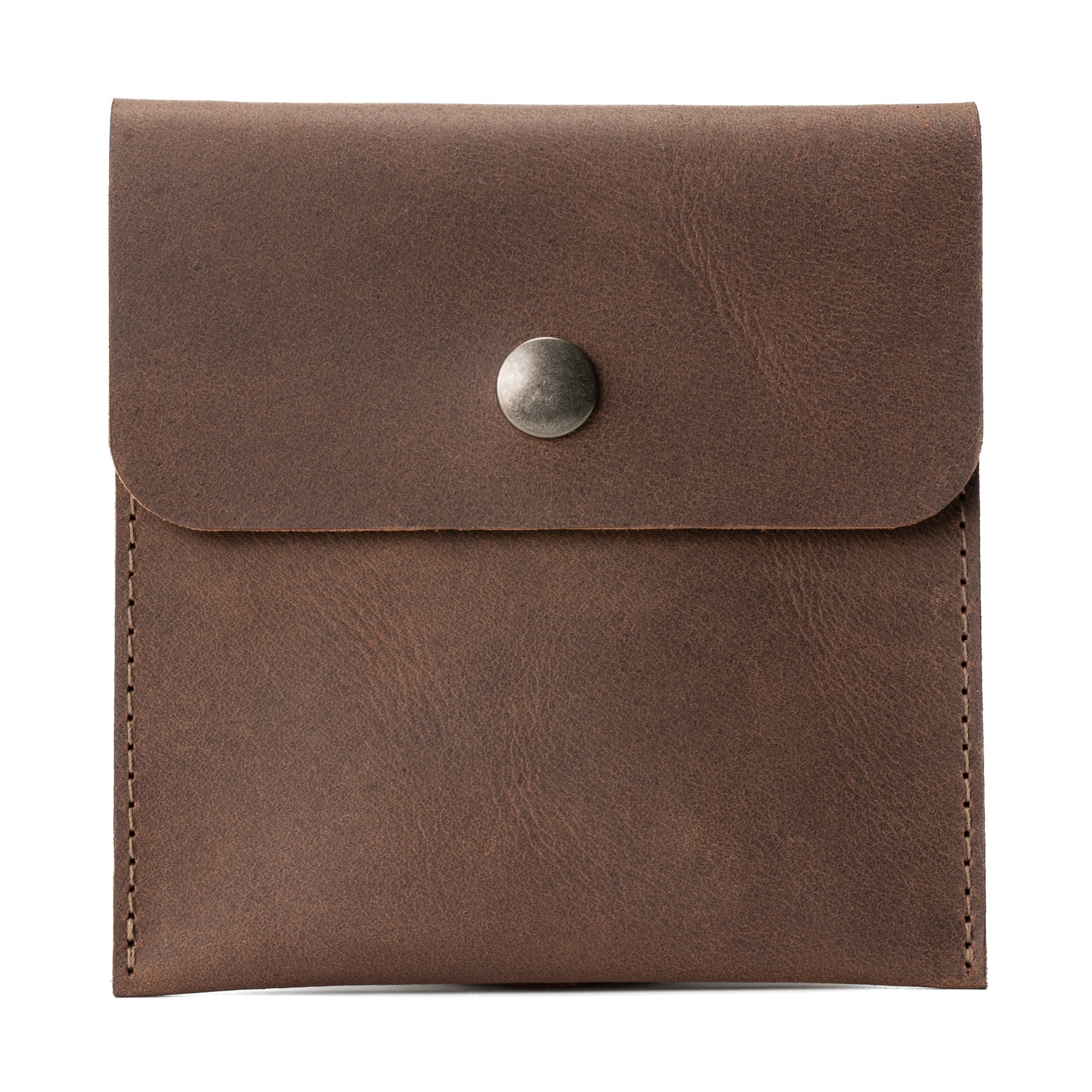 Hide & Ride Document Handlebar Bag made of full grain leather, showcasing a compact design suitable for motorcycle handlebars. This Motorcycle Document Bag is a perfect small bag for handlebar storage and essential biker accessories, emphasizing artisan craftsmanship from StockyardX with small batch production.