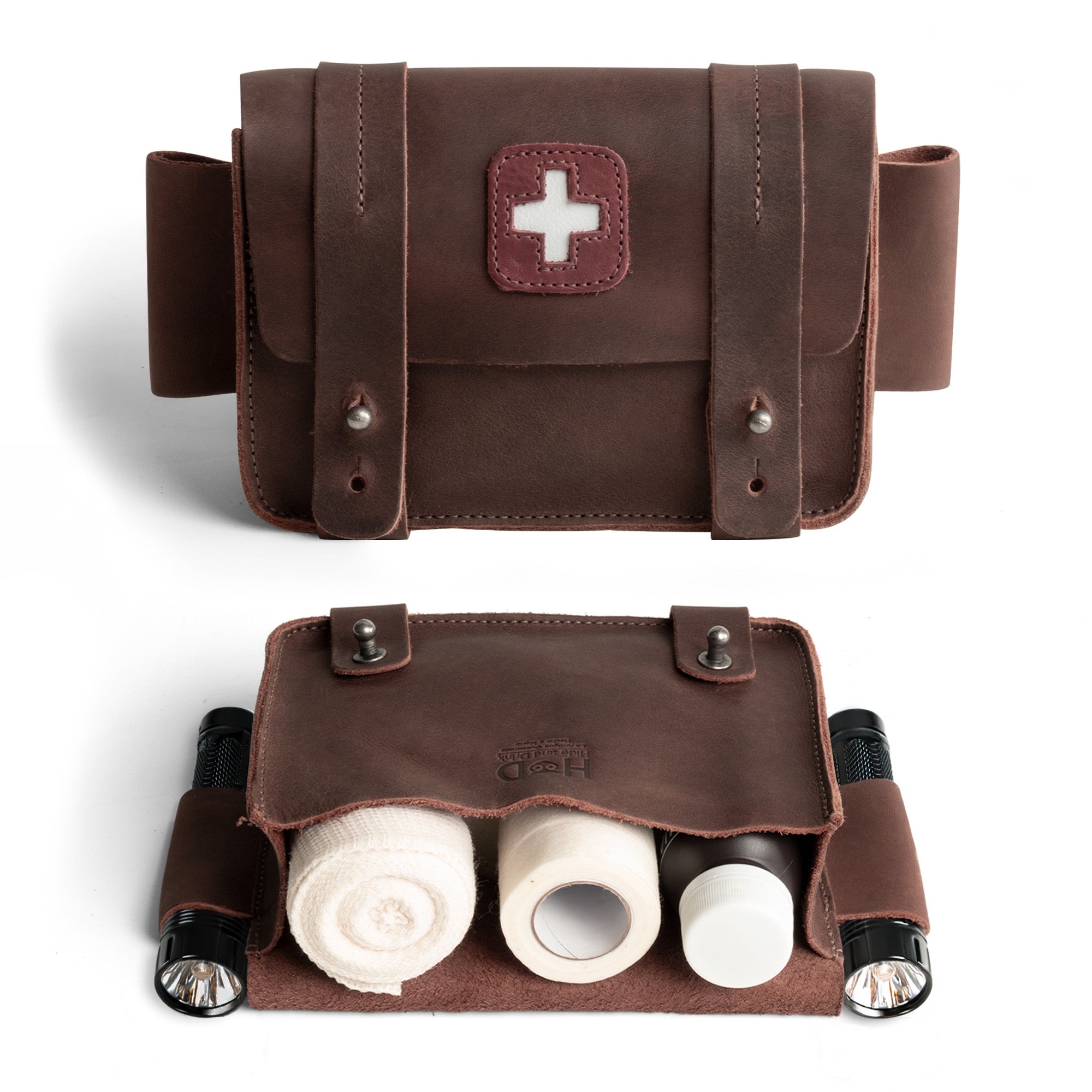 Hide & Drink's Empty First Aid Bag, Mini Medical Storage Pouch showcasing a rustic design made from Full Grain Leather. This Empty First Aid Bag serves as a compact container storage solution for travel and home, perfect to organize your medical kit. Features include hand cut and hand sewn craftsmanship, making it a unique artisan piece from small batch production in La Antigua Guatemala.