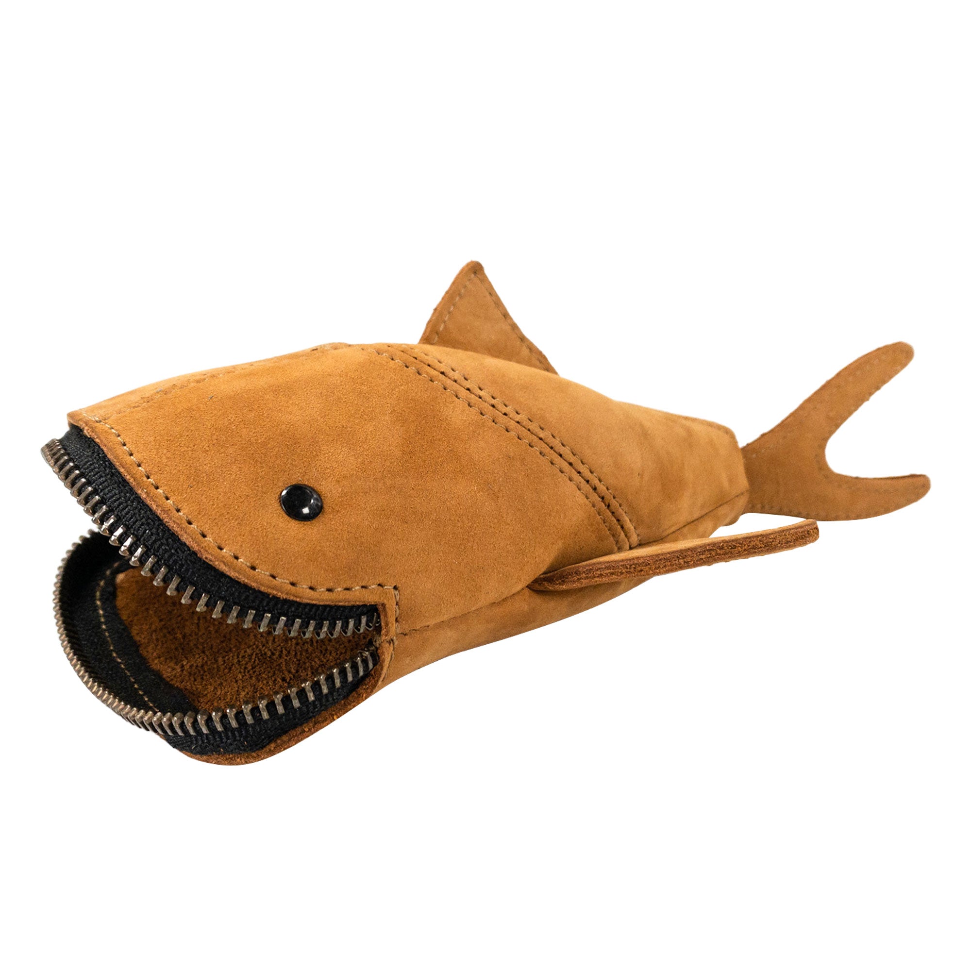 Casual view of the green Leather Shark Pouch by Hide & Drink, emphasizing its playful design. This zippered coin pouch functions well as a shark shaped pencil purse or storage for small items. Each pouch is artisan crafted from full grain leather, handmade in La Antigua Guatemala & Oaxaca Mexico with attention to detail.