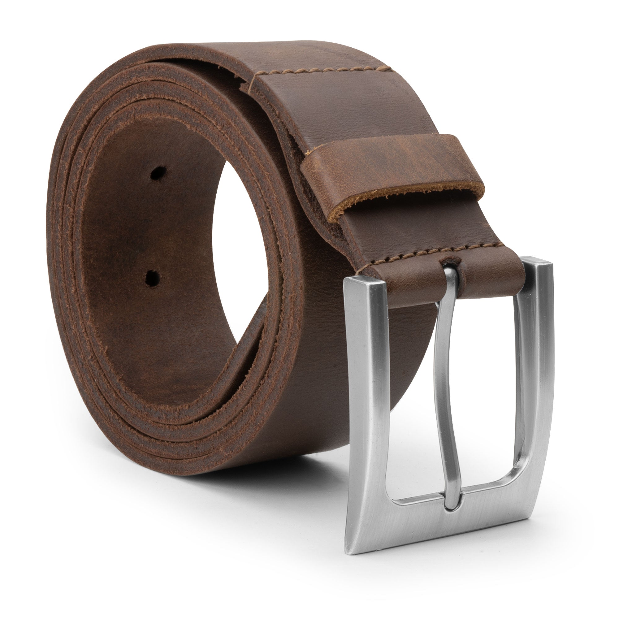 Rustic Leather Belt by Hide & Drink made from thick full grain leather showcasing a stylish silver buckle, emphasizing small batch production and artisan craftsmanship with hand cut and hand sewn details, made in La Antigua Guatemala.