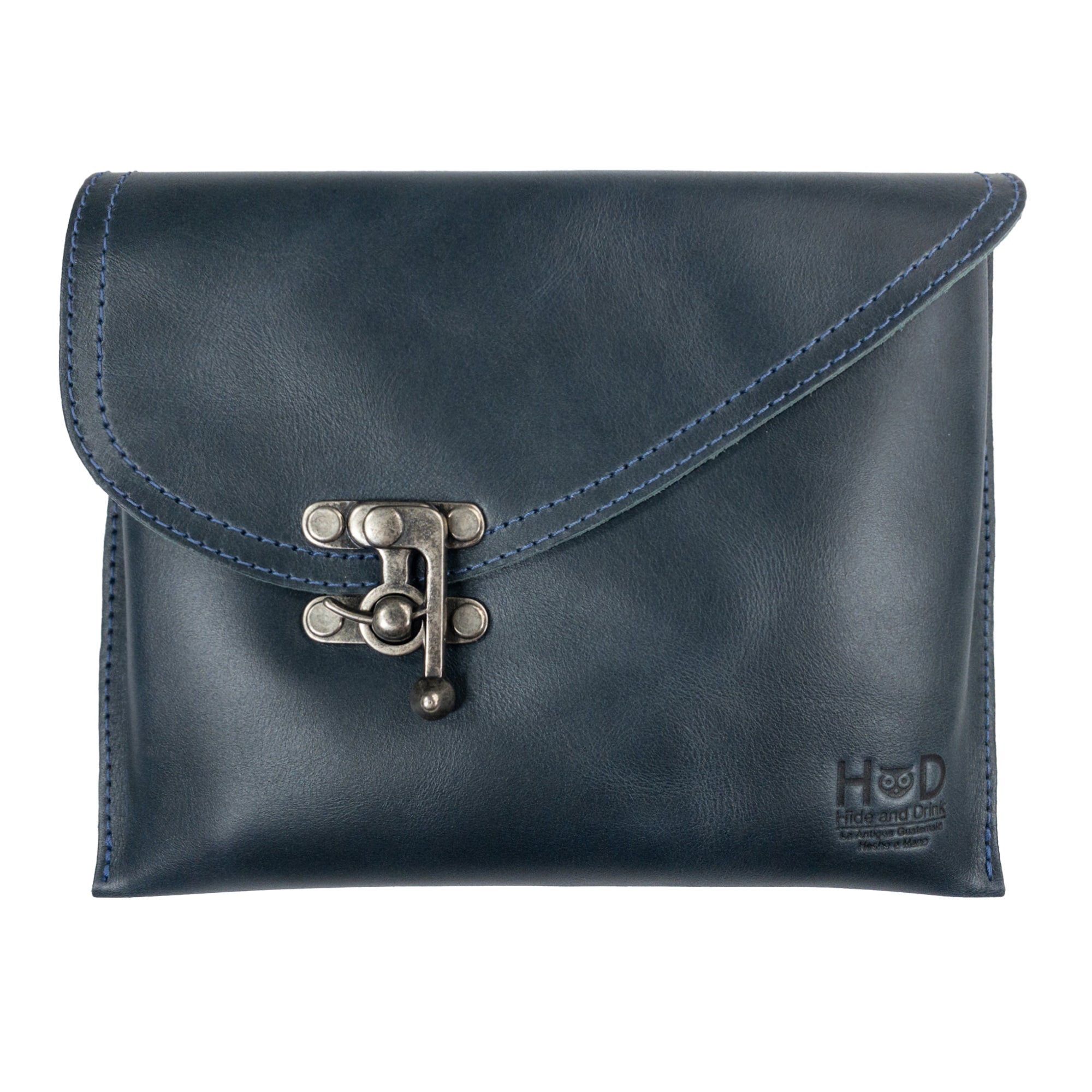 Front view of the navy version of the Petite Vintage Clutch Bag by Hide & Drink, highlighting its unique design and vintage clasp. Made from full grain leather, it's a stylish evening bag and travel accessory for the discerning individual. Each bag is artisan-made in La Antigua Guatemala & Oaxaca Mexico.