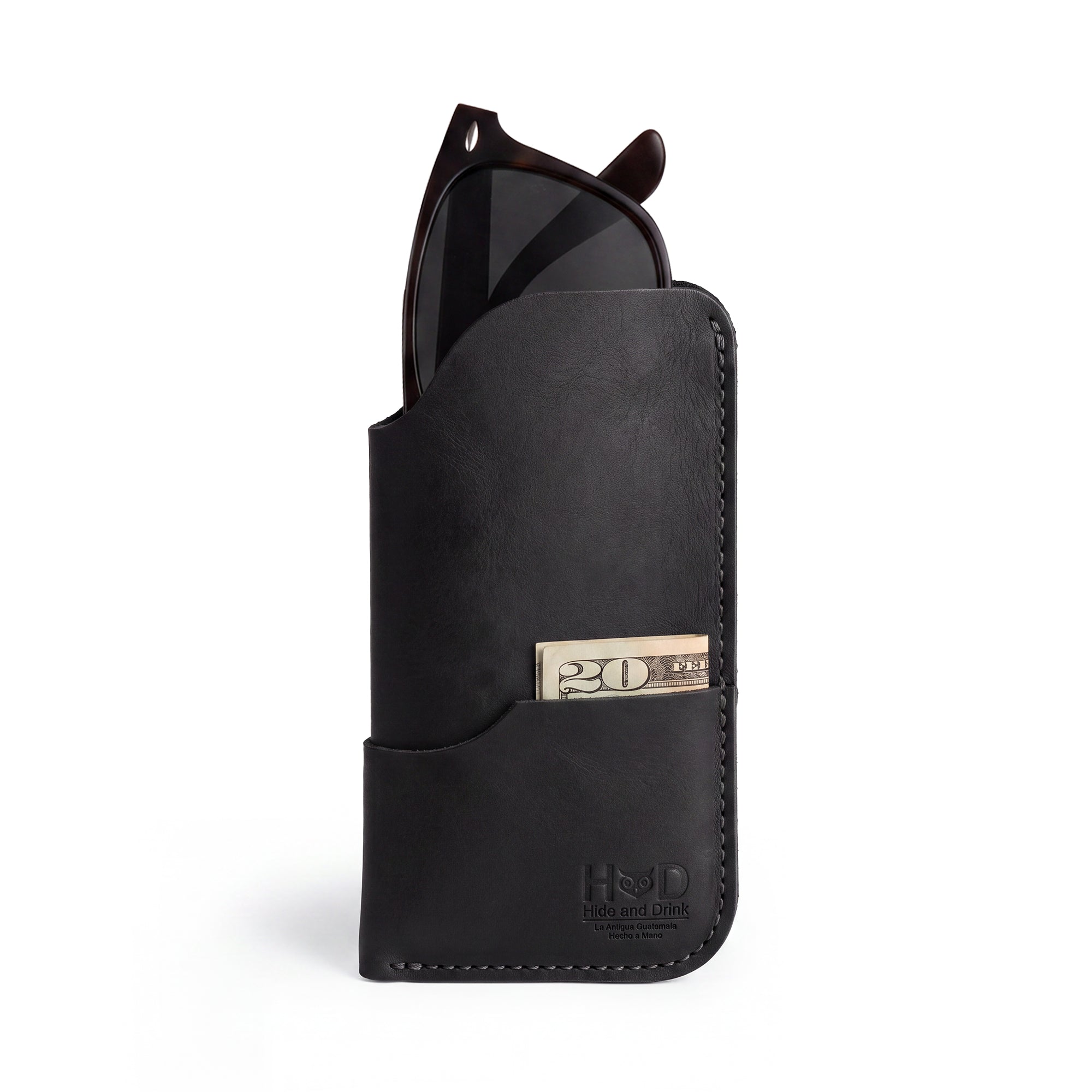 Introductions to the Hide & Drink Sunglass Case & Wallet in black leather, showcasing its premium quality. This Rustic Sunglasses Case & Wallet is an excellent eyeglasses sleeve for travel, featuring hand-made artisan craftsmanship from La Antigua Guatemala & Oaxaca Mexico.