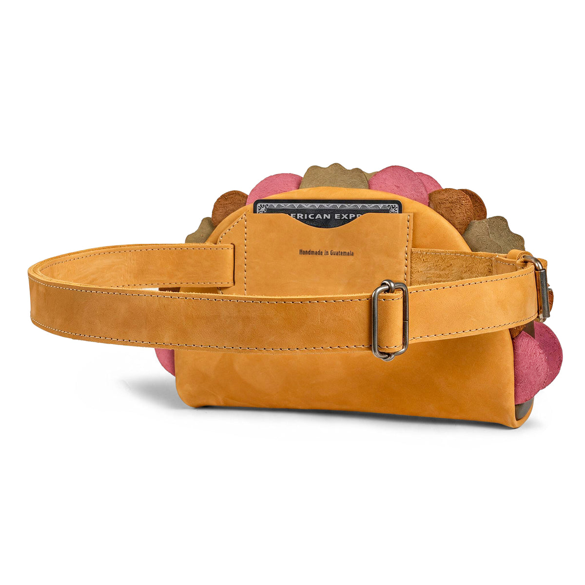 Rear view of the Hide & Drink Taco Fanny Pack in tan full grain leather, showing the adjustable belt strap, buckle, and zippered compartment. This waist bag is one of the fun belt bags, zippered bags, travel carrier, outdoor waist pouch, carry on case, and travel accessory styles by StockyardX, featuring small batch production, hand cut, hand sewn, fire branded artisan craftsmanship, and handmade in La Antigua Guatemala & Oaxaca Mexico construction.