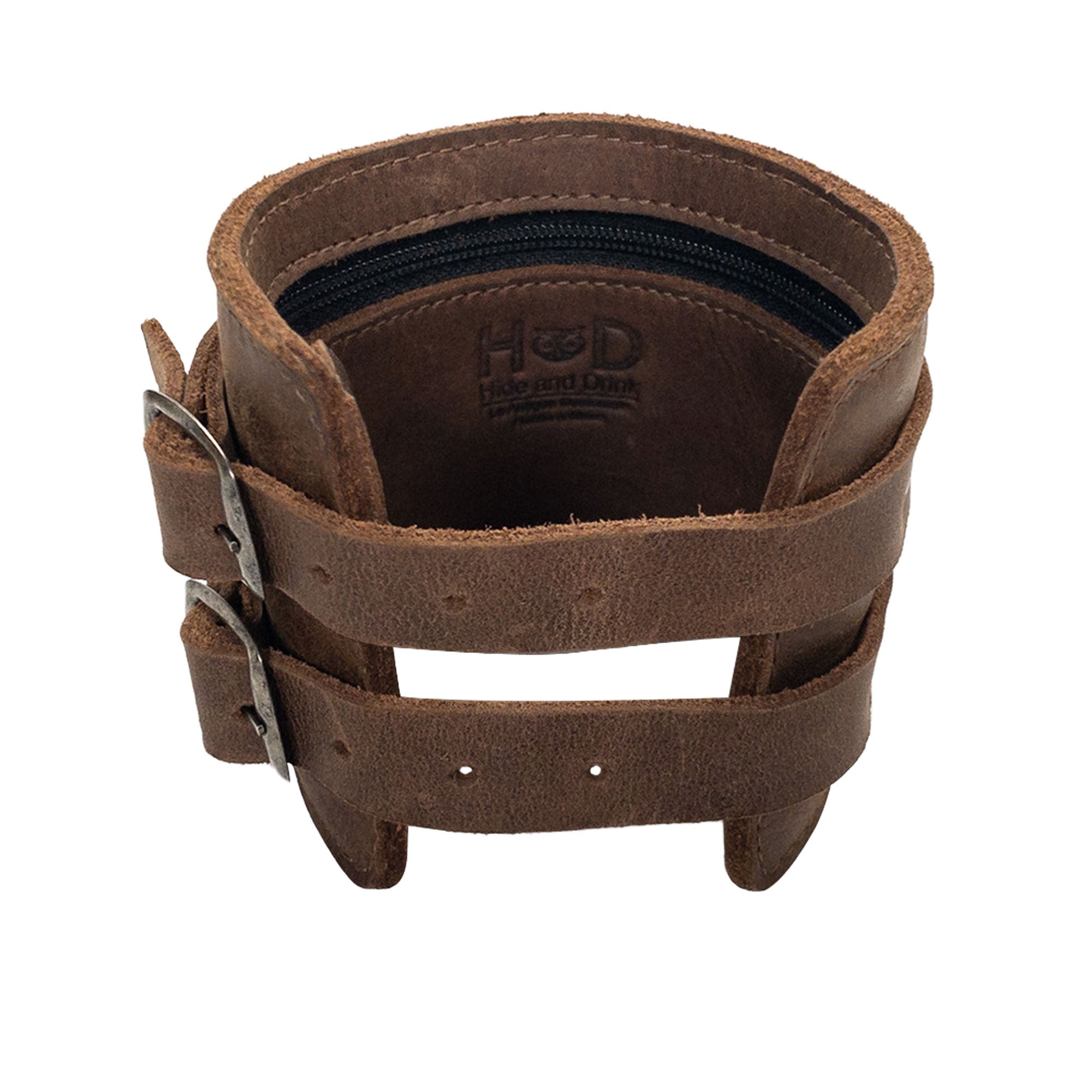 An elegant look at Hide & Drink's Wrist-Wallet-Cuff made from Full Grain Leather, featuring a rustic style. This leather bracelet includes a hidden pouch for bills and an inner zippered pouch, great for modern needs. Artisan-crafted in La Antigua Guatemala & Oaxaca Mexico, showcasing quality craftsmanship.