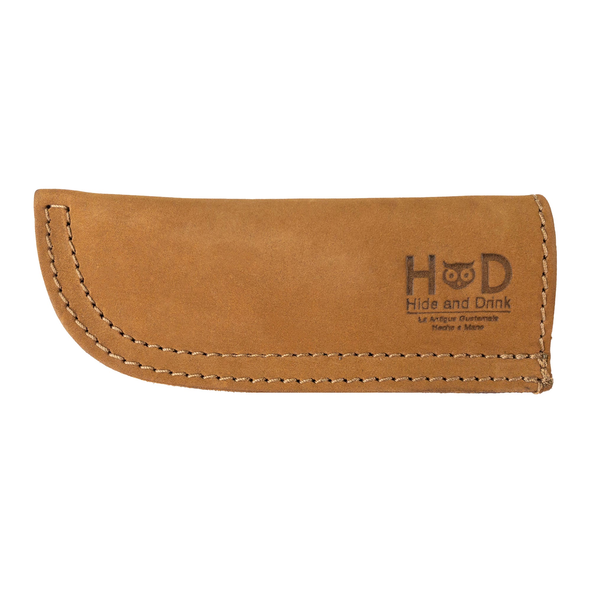 Hide & Drink Cast Iron Panhandle Cover featured with its packaging, emphasizing quality craftsmanship. This hot handle protector is made from full grain leather and showcases artisan precision through its double stitched design. Handmade in La Antigua Guatemala & Oaxaca Mexico, it's a stylish addition to any kitchen gear.