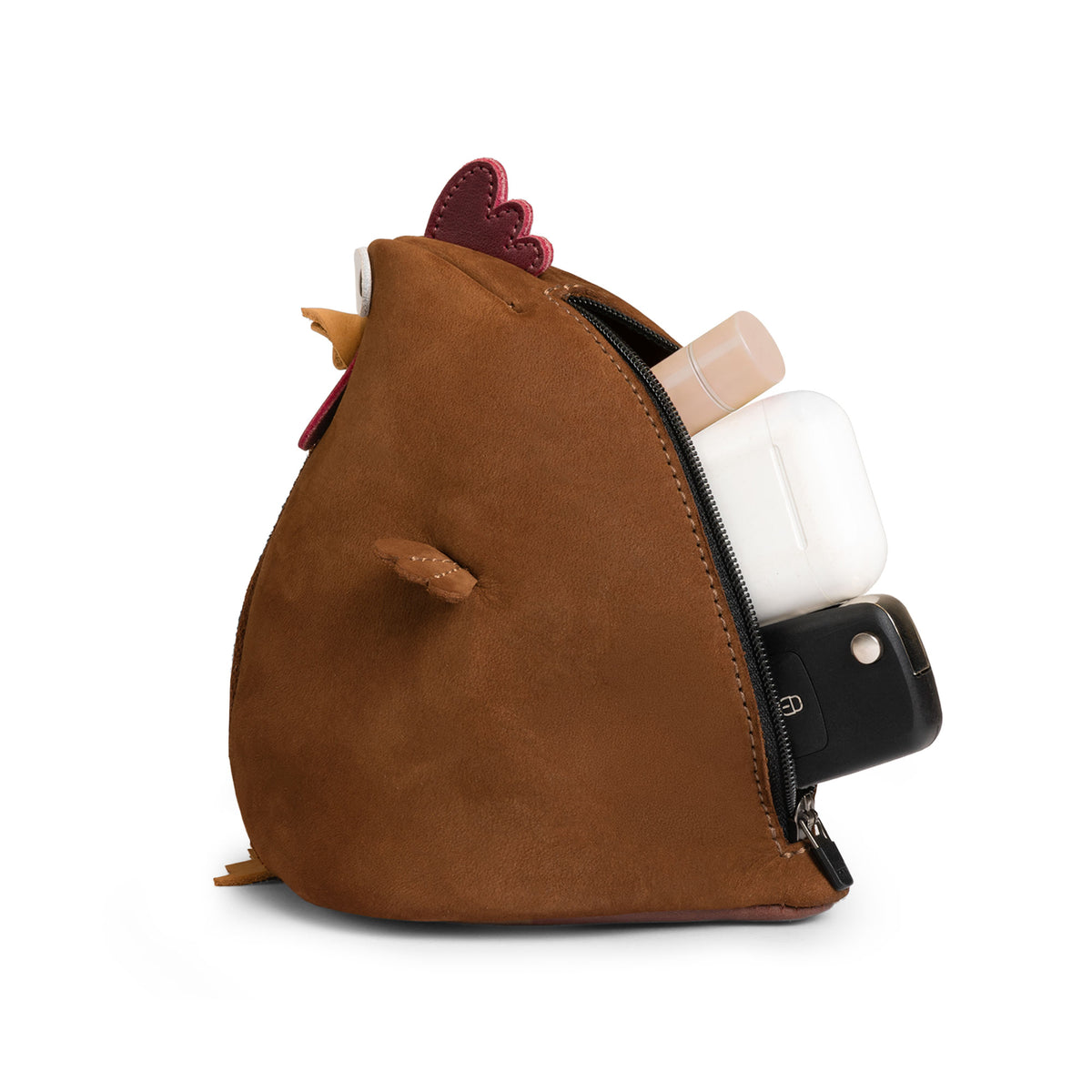 Side view of the Tudi Frudi Leather Chubby Chicken Pouch opened to show personal items inside. This Leather Chubby Chicken Pouch Coin Purse is a Full Grain Leather Small Charger Cable Holder, Change Bag, Scissors Case, and Travel Zippered organizer for Purses & Pouches for Cash, made by StockyardX through Small Batch Production with Hand Cut, Hand Sewn, Fire Branded, Artisan craftsmanship, Handmade in La Antigua Guatemala & Oaxaca Mexico.