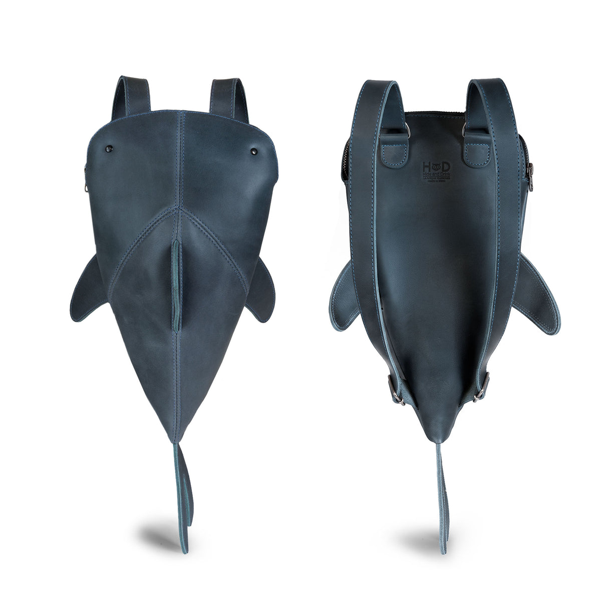 Hide & Drink Leather Shark Backpack (Megalodon) displayed front and back to show its shark shape, leather construction, fins, and compact storage design. Leather Shark Backpack (Megalodon), Casual Bag, Messenger Bag, Travel Bag for Men and Women, Full Grain Leather, StockyardX, Small Batch Production, Hand Cut, Hand Sewn, Fire Branded, Artisan, Handmade in La Antigua Guatemala & Oaxaca Mexico.