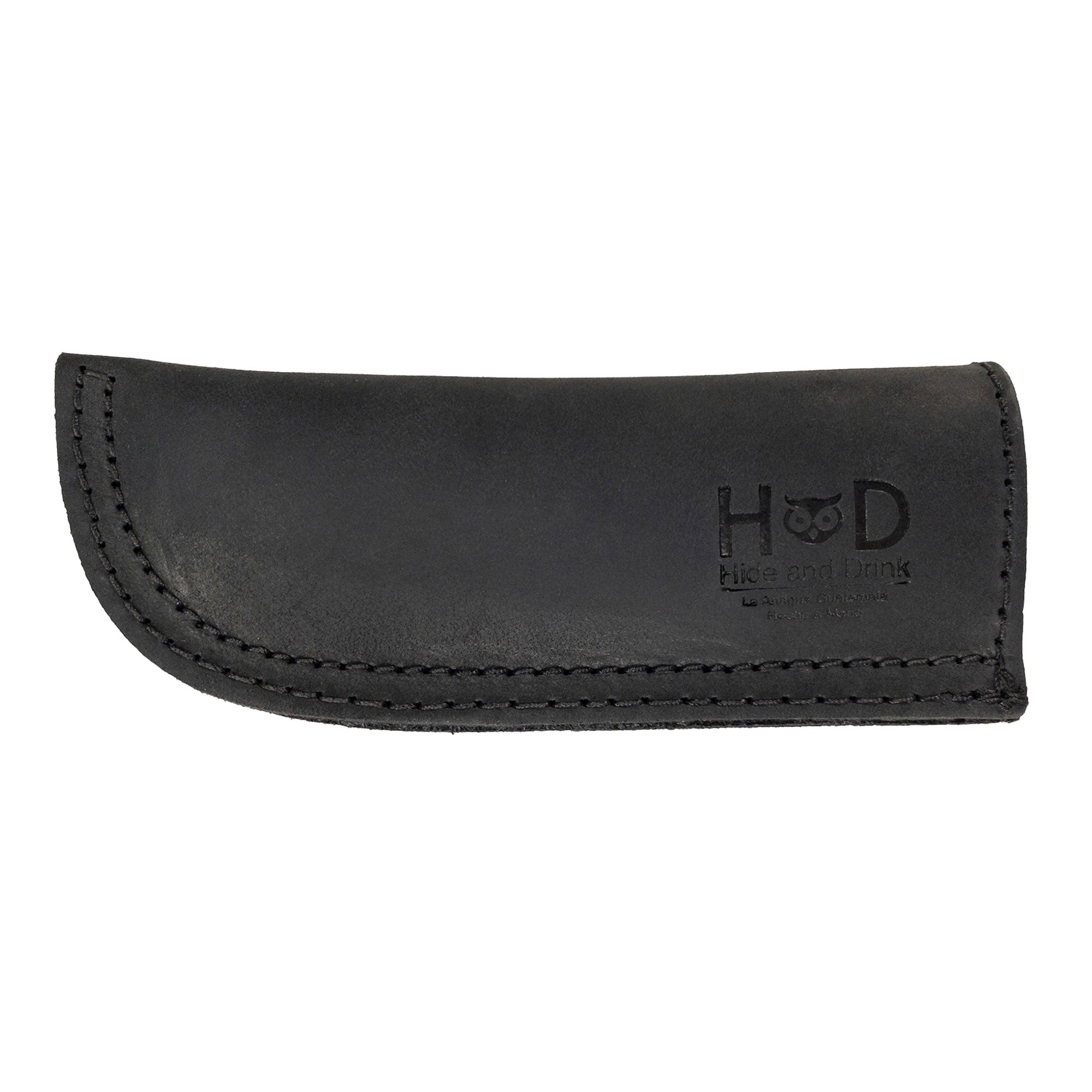 Hide & Drink Cast Iron Panhandle Cover showcased in a stylish angle, highlighting its craftsmanship. This hot handle protector, designed for easy application to metal skillets, exemplifies full grain leather quality. Handmade in La Antigua Guatemala & Oaxaca Mexico, it’s perfect for adding flair while cooking.