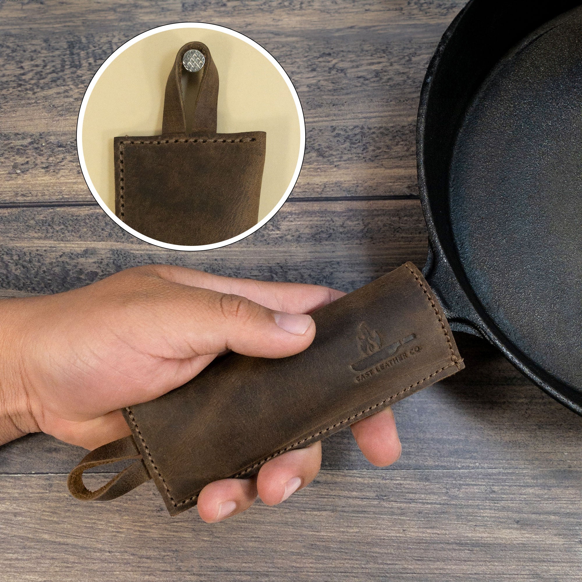 Person holding a Set of 2 Rectangular Pan Handle Covers by Cast Leather Co., illustrating the comfort and practicality of this sleeve for metal skillet grip. These kitchen accessories are made from full grain leather, emphasizing small batch production and artisan craftsmanship from La Antigua Guatemala & Oaxaca Mexico.