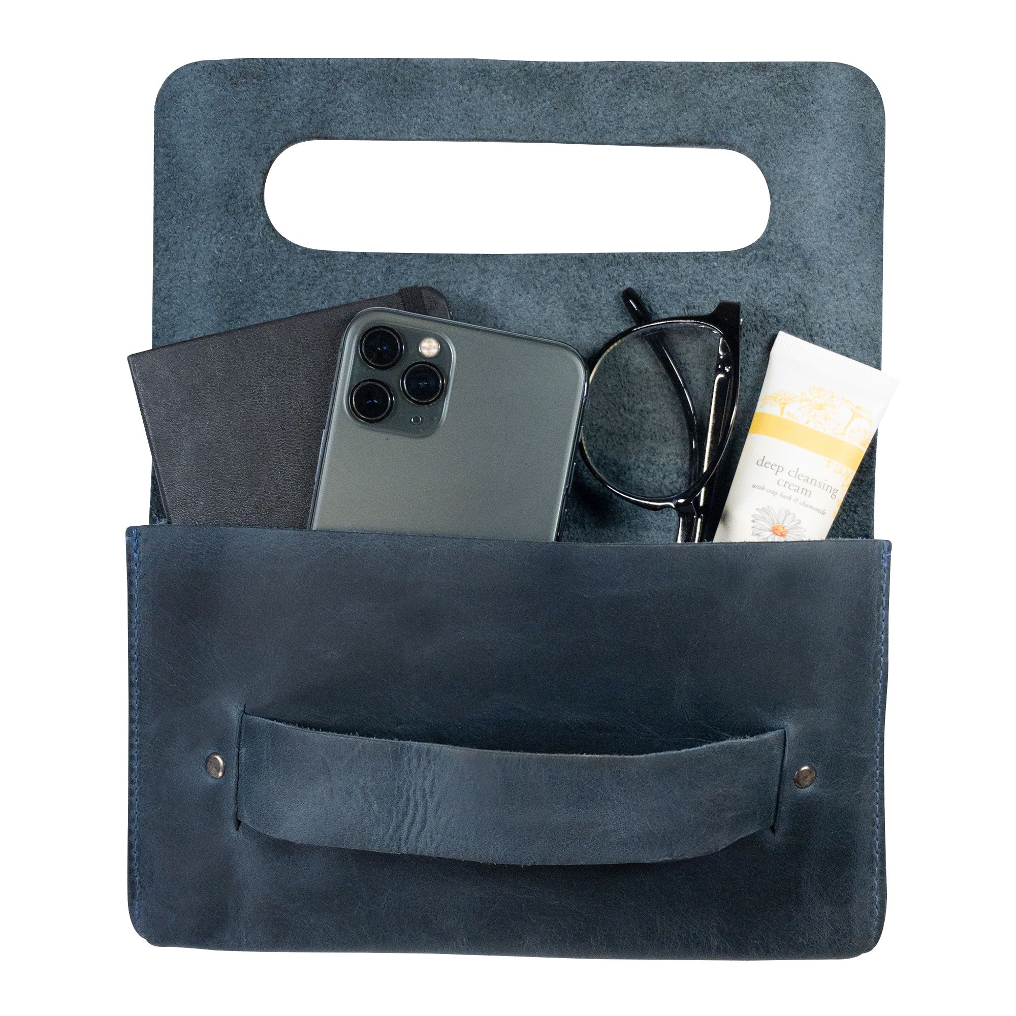Interior view of the navy Clutch Bag With Handle from Hide & Drink, showcasing its spacious design for essentials. This Full Grain Leather Clutch Bag with Handle is ideal for women looking for a chic handbag or night bag, lovingly handcrafted in Guatemala and Mexico.