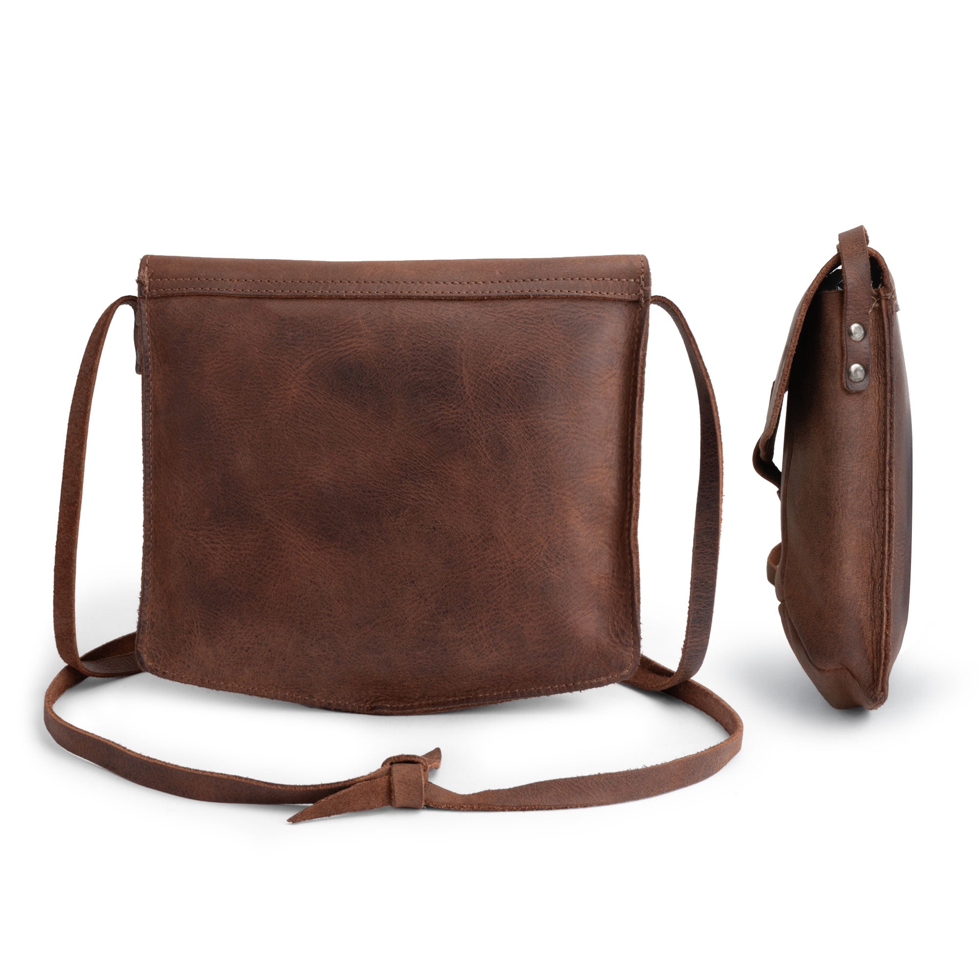 Back view of the Prisma Shoulder Bag from Hide & Drink, emphasizing its minimalist design. This vintage purse is not only a chic accessory but also a functional messenger and crossbody bag crafted from durable full grain leather. Hand cut and hand sewn, it represents the quality and craftsmanship of artisan production in La Antigua Guatemala & Oaxaca Mexico.