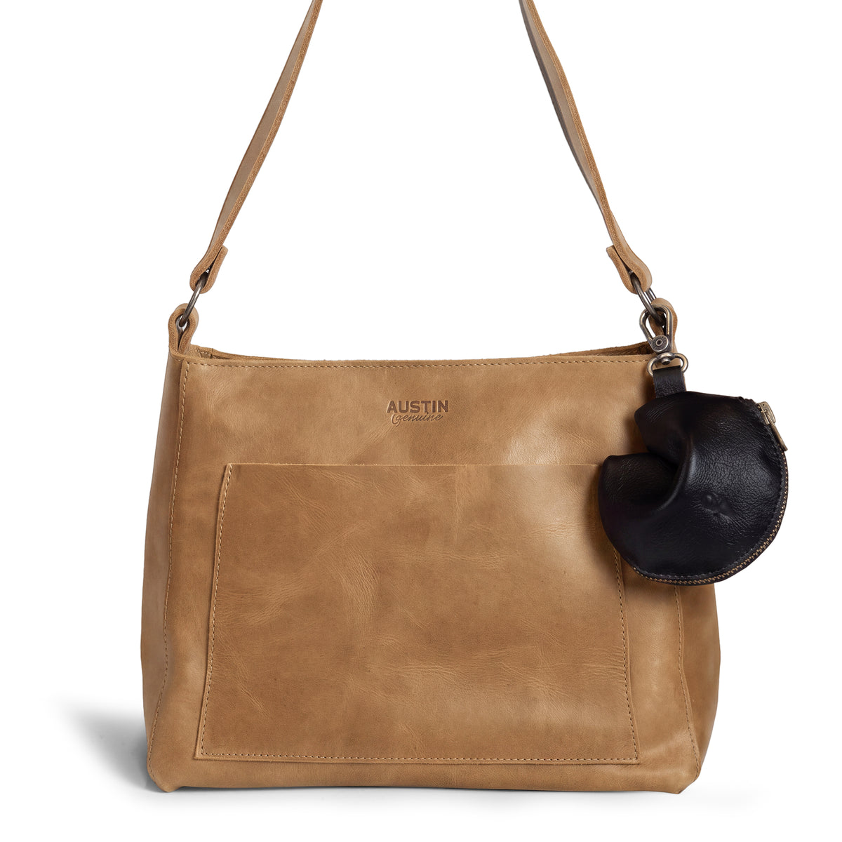 Austin Genuine The Bouldin Fortune Cookie Pouch in black Full Grain Leather attached to a tan shoulder bag; StockyardX Small Batch Production, Hand Cut, Hand Sewn, Fire Branded, Artisan, Handmade in La Antigua Guatemala & Oaxaca Mexico.