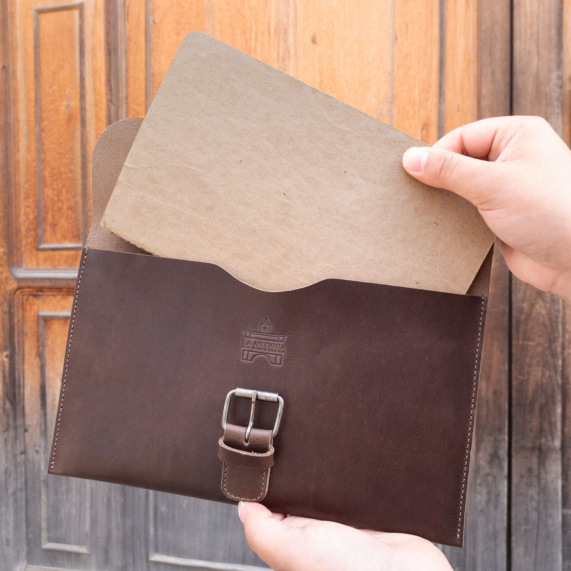 Inside view of La Antigua's Rectangular Case for Notebook, revealing a stylish pocket for an 8.25 x 5 in. notebook. This protective cover serves as a classic sleeve travel accessory, meticulously crafted from full grain leather. Hand cut and hand sewn, it's a unique artisan product from La Antigua Guatemala, reflecting small batch production with a fire branded finish.