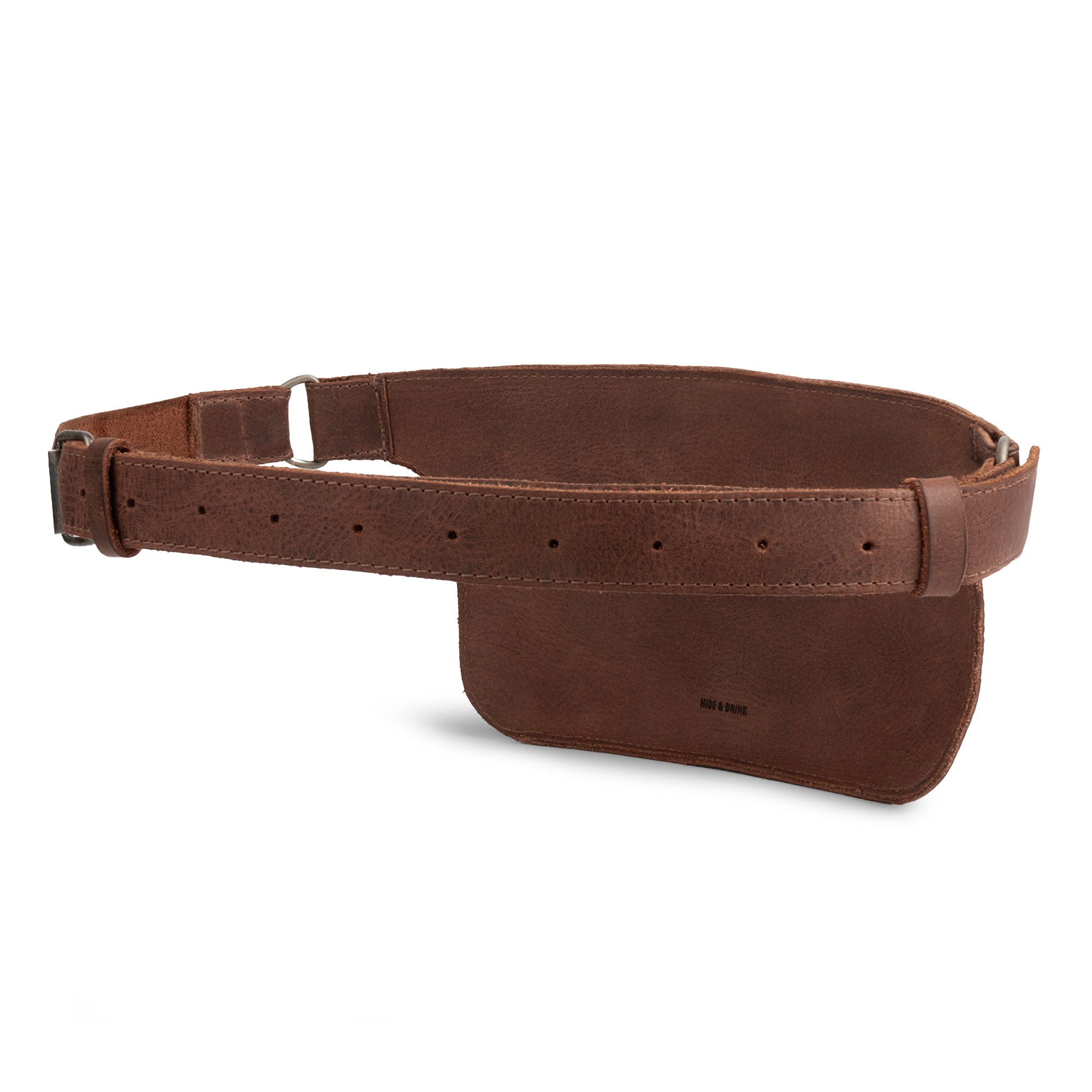 Slim Fanny Pack by Hide & Drink displayed from a side angle, featuring an adjustable strap and a streamlined shape, ideal as a phone holder or cable case. Crafted from full grain leather, this handmade accessory is part of small batch production in Oaxaca Mexico.