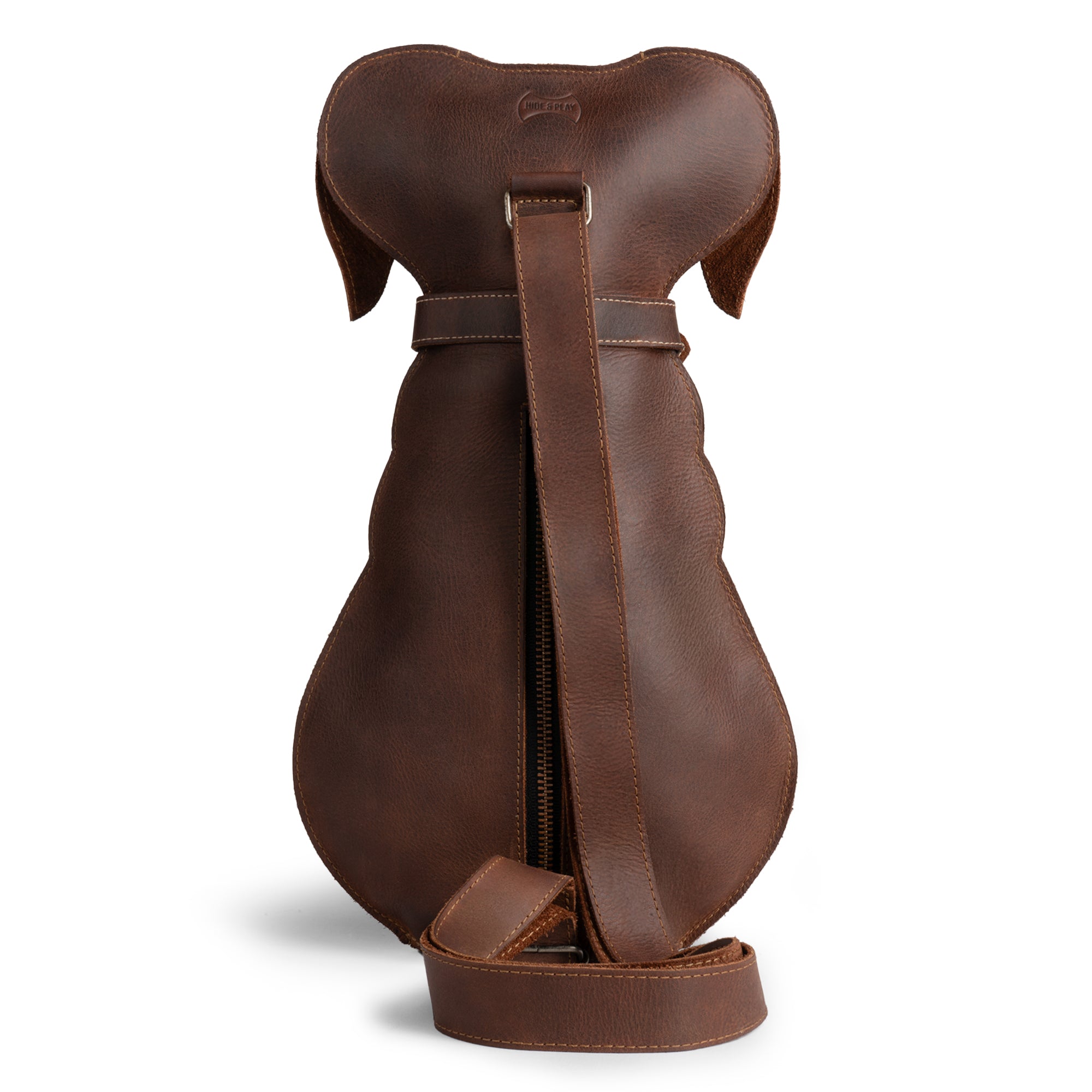 Side view of a Doggy-Shaped Backpack by Hide & Play, featuring a sleek design and adjustable strap. This fashionable Pet Lover Accessory is perfect for everyday use. Made from durable full grain leather, this crossbody bag exemplifies artisan craftsmanship through hand-cut and hand-sewn techniques, reflecting the unique beauty of handmade goods from La Antigua Guatemala.