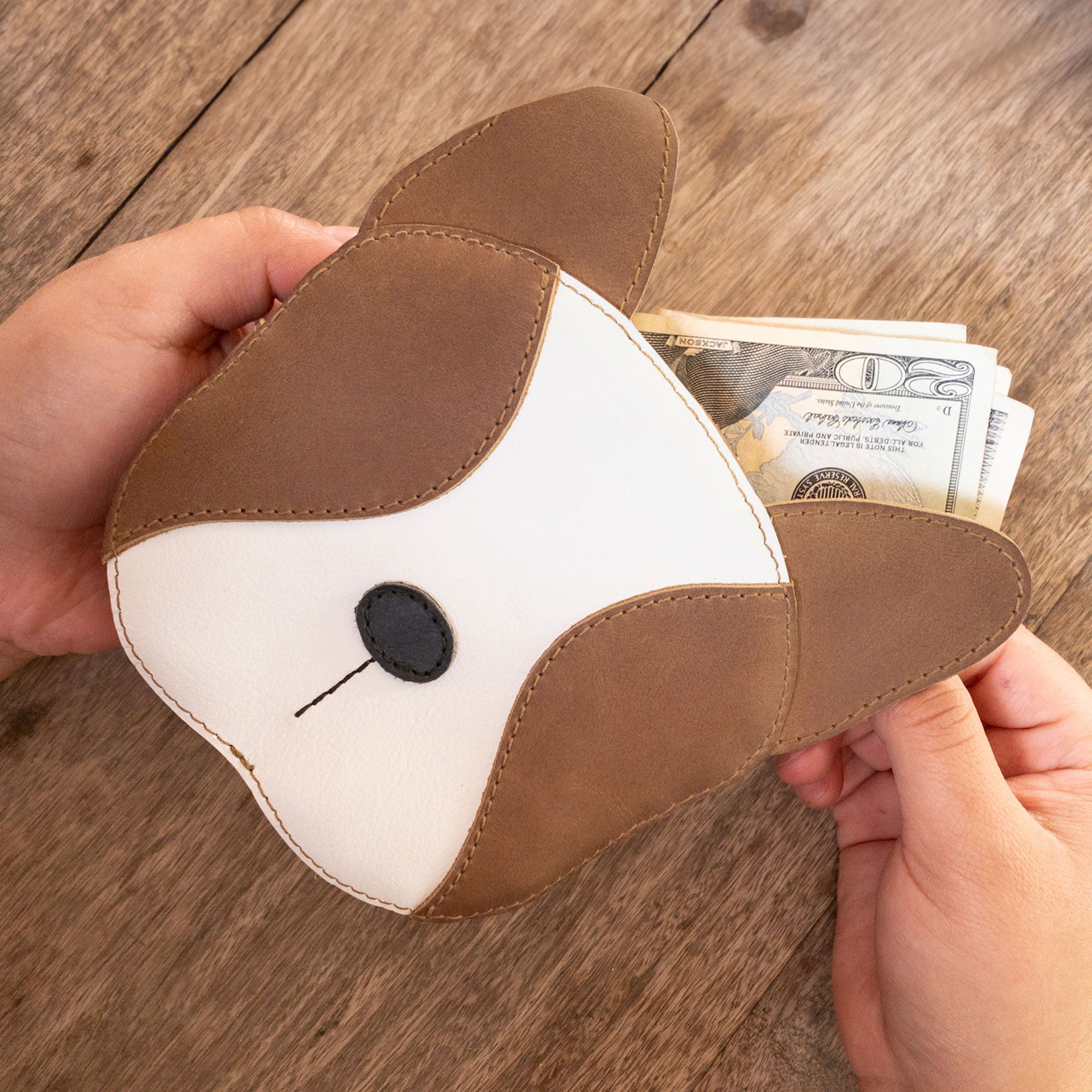 Functional French Bulldog-Shaped Leather Wallet by Taco Dog, designed to hold cash easily. This adorable handbag doubles as a coin pouch, crafted from high-quality full grain leather. Handmade in La Antigua Guatemala, it highlights artisan skill through small batch production, perfect for travel and pet lovers alike.