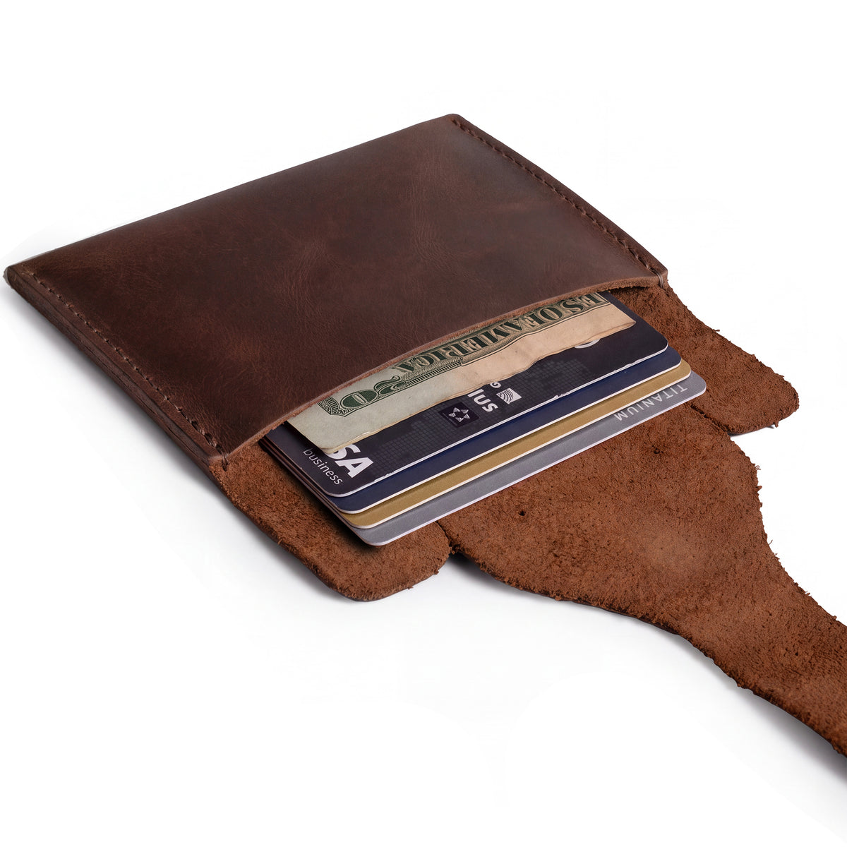 Elephant Coin Pouch by Hide & Drink showcasing a credit card inside, made from durable full grain leather, this elegant pouch is perfect for tokens and essentials. Card Pouch Elephant/Coin & Folded Bills/Wallet/Cable Holder/USB/SD/Change, Full Grain Leather, StockyardX, Hand Cut, Hand Sewn, Fire Branded, Artisan, Handmade in La Antigua Guatemala & Oaxaca Mexico.