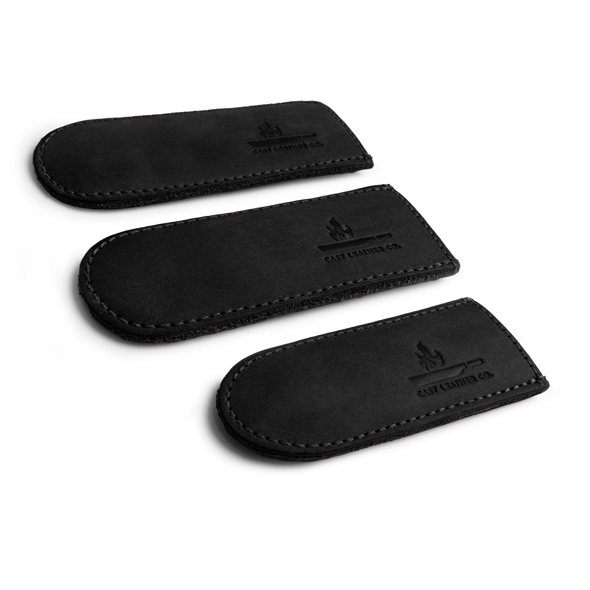 The black variant of Cast Leather Co.'s Hot Handle Covers (Set of 3) displayed, demonstrating its practicality and stylish design made from full grain leather for cast iron pans. Ideal for safe cooking, each piece is hand cut, hand sewn, and fire branded.