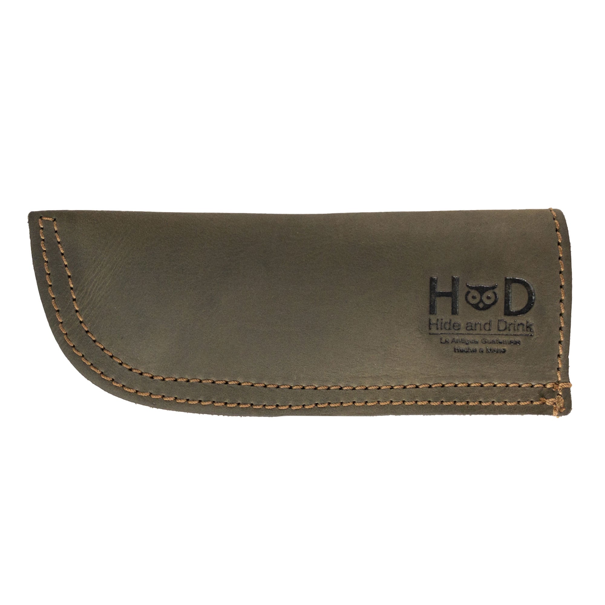 Hide & Drink Cast Iron Panhandle Cover showcased against a clean background. This artisan hot handle protector is made from durable full grain leather and features a double stitched design for strength. Handmade in La Antigua Guatemala & Oaxaca Mexico, it enhances both the safety and style of your kitchen.