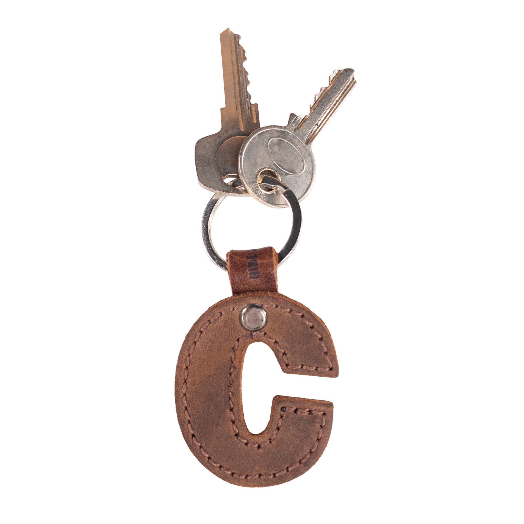 Unique 'C' thick leather Alphabet Letter Keychain by Hide & Drink, ideal for adding a personal touch to your keys. Artisan crafted in La Antigua Guatemala.